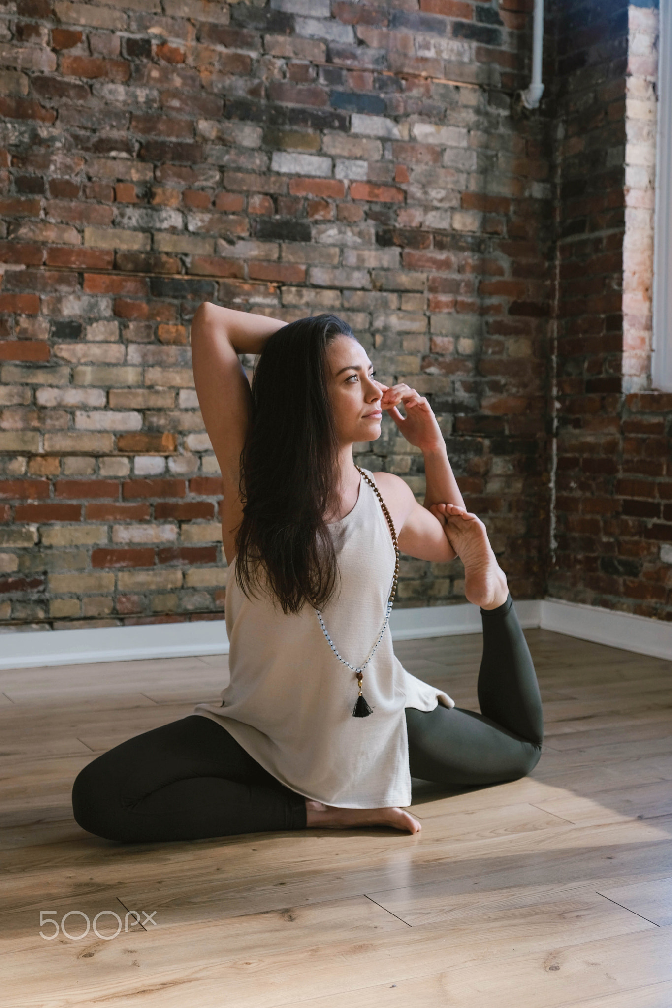 Young woman practicing yoga and self care,Elizabeth Vecchio