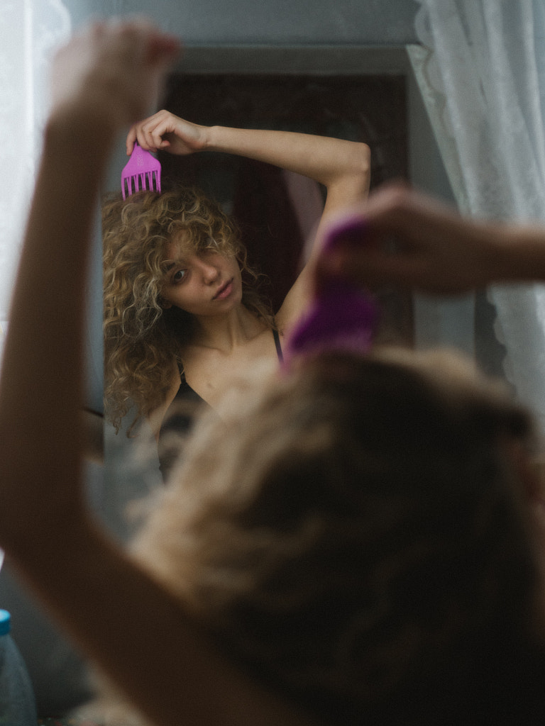 woman brushing her curly hair, Russia, Anna Koniashkina by Aks Huckleberry on 500px.com