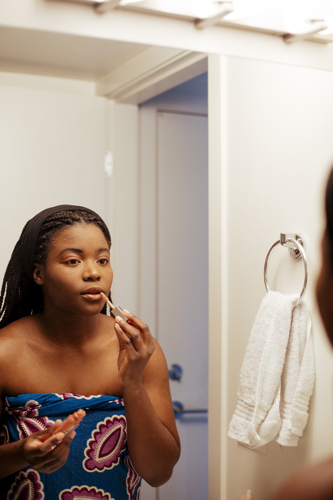 Young woman Applying Make-up in mirror, Delator "Dela" Hini by Hagar Wirba on 500px.com