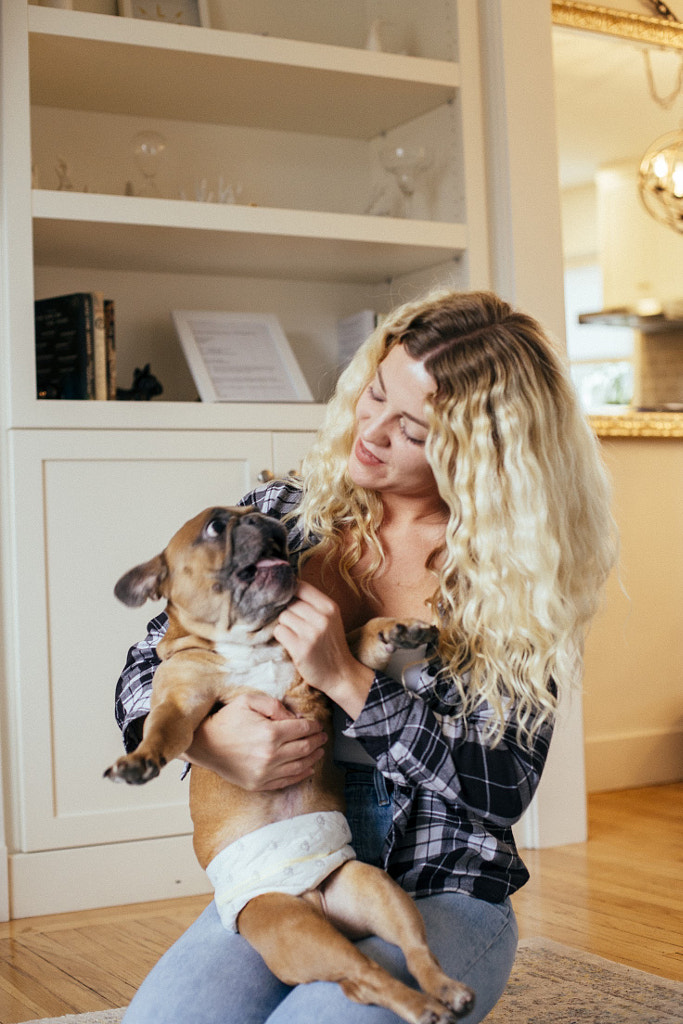 Young woman holding her dog in her home, Amanda Van Delee by Hagar Wirba on 500px.com