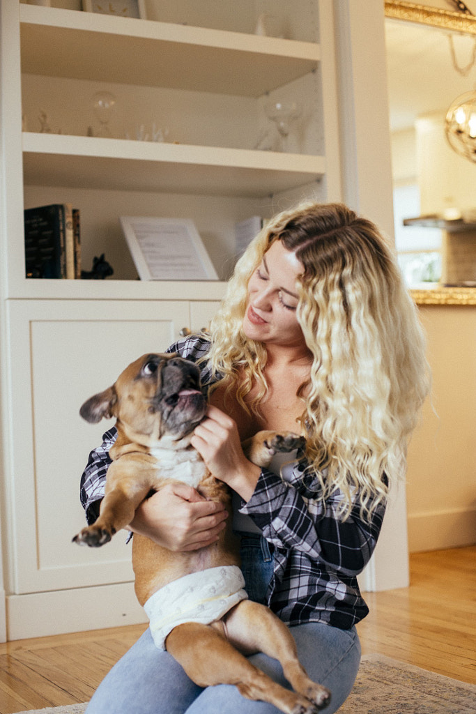 Young woman holding her dog in her home, Amanda Van Delee by Hagar Wirba on 500px.com