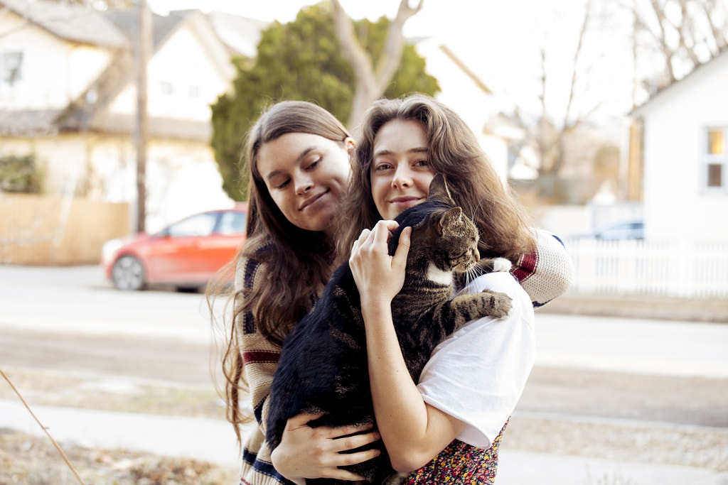 Young friends holding cat, Asha Hannan, Zenaeja Henry-Lafrance by Hagar Wirba on 500px.com