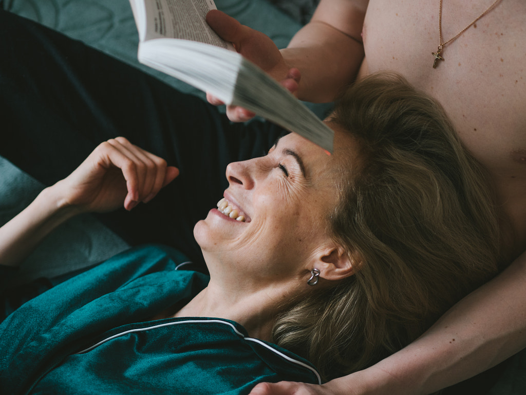 mature woman& her partner reading a book together,Russia,Inna Lyapneva by Aks Huckleberry on 500px.com