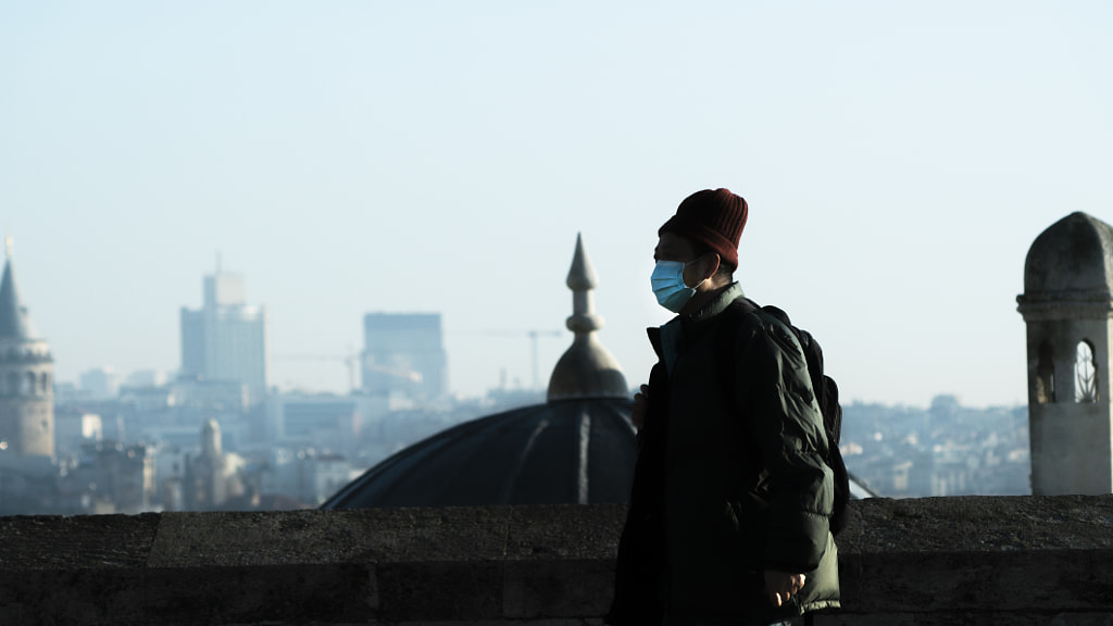 Corona virus. Covid-19. Masked man in turkey. Galata tower. by Tolga Ta?temel on 500px.com