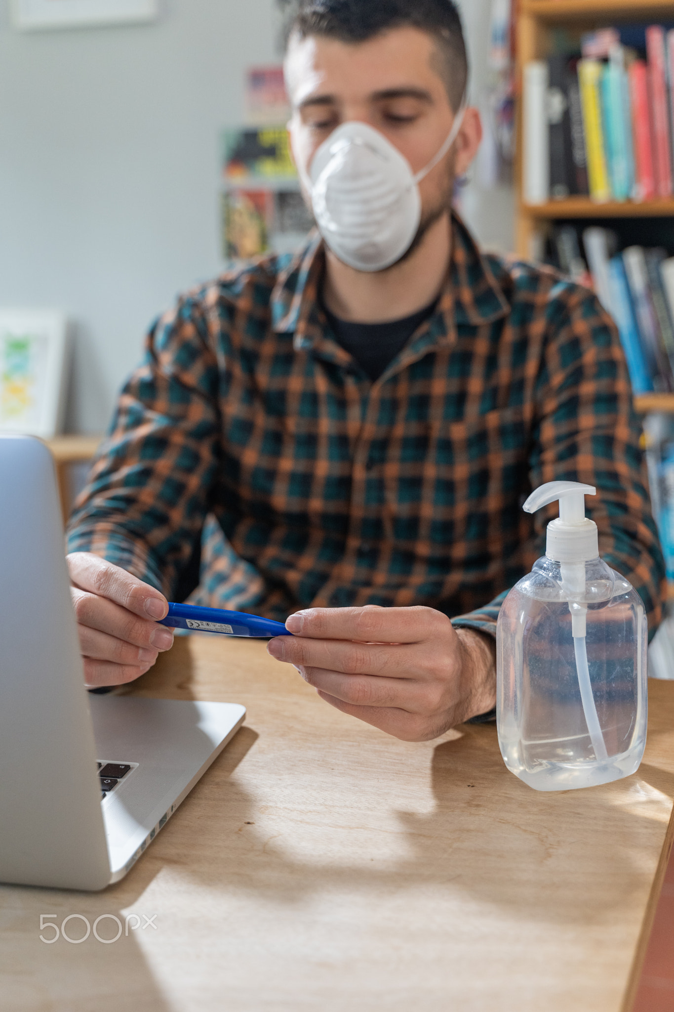 Coronavirus. Man working from home  protective mask. Quarantine