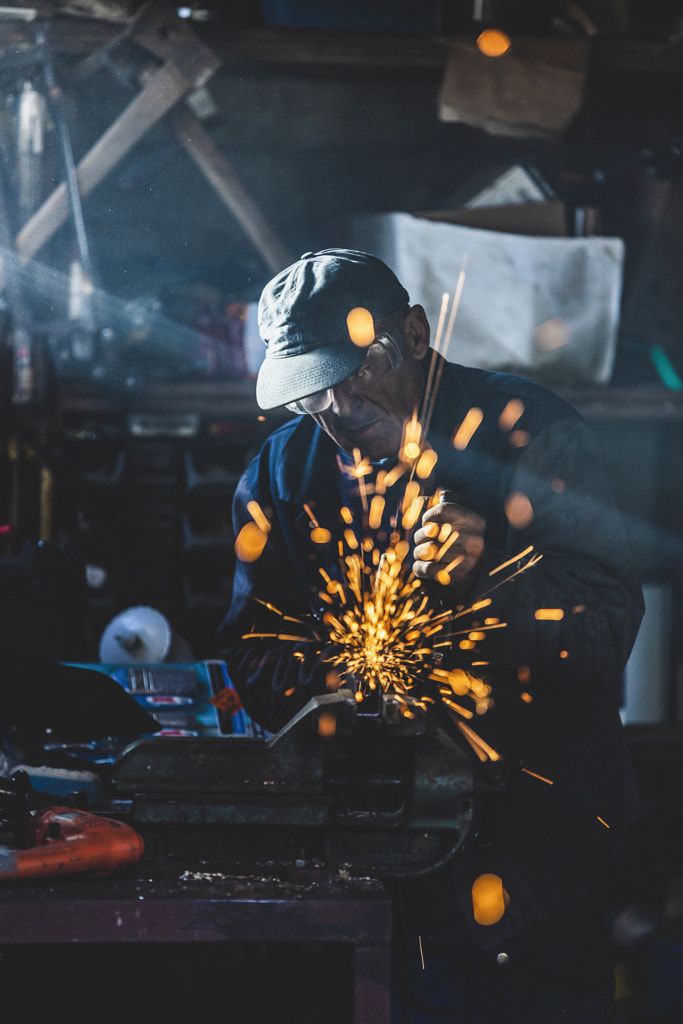 Engineer Grinding Metal Tube by Jure Batagelj on 500px.com