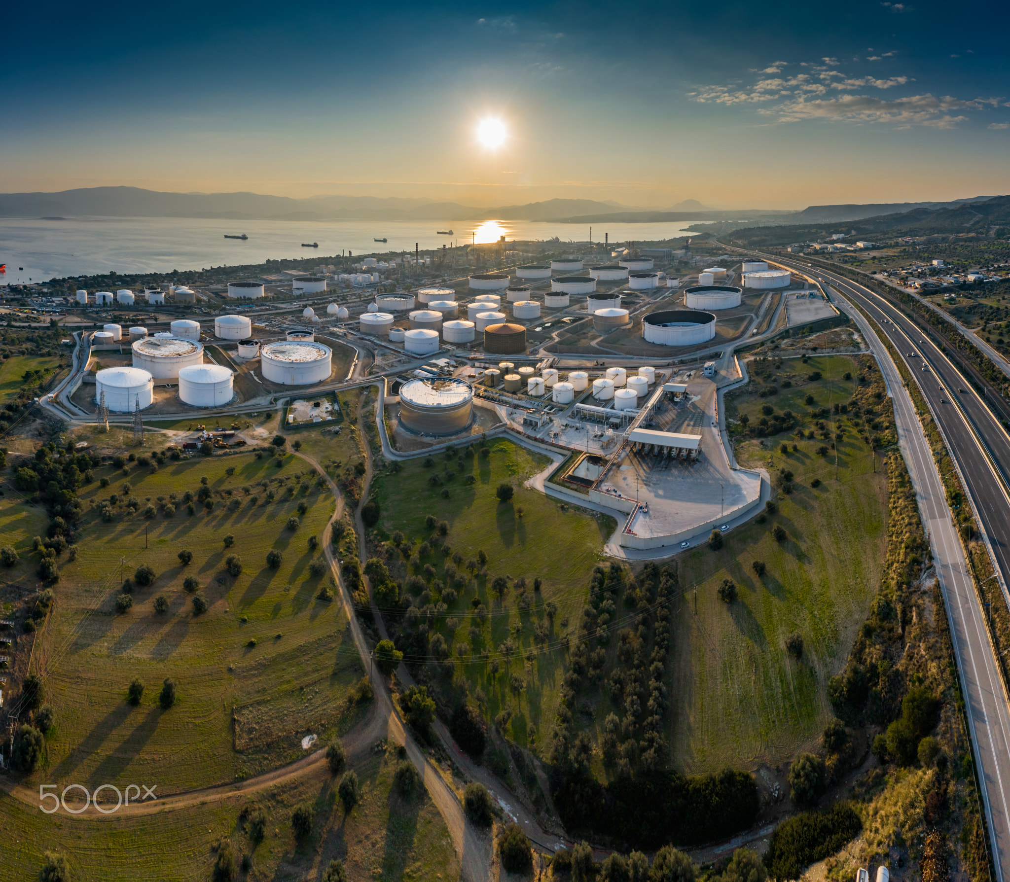 Aerial view of Chemical plant at sunset, oil refining, smoke, pipes