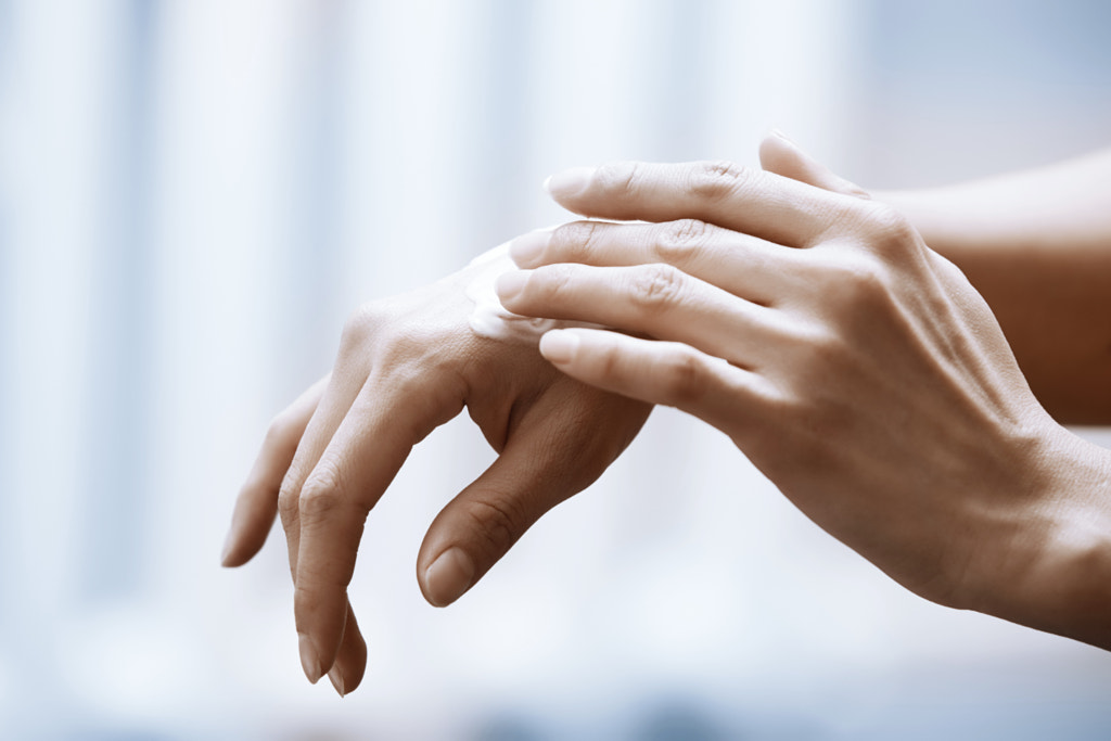 Woman applying moisturizing cream on hands by ????? ???????? on 500px.com