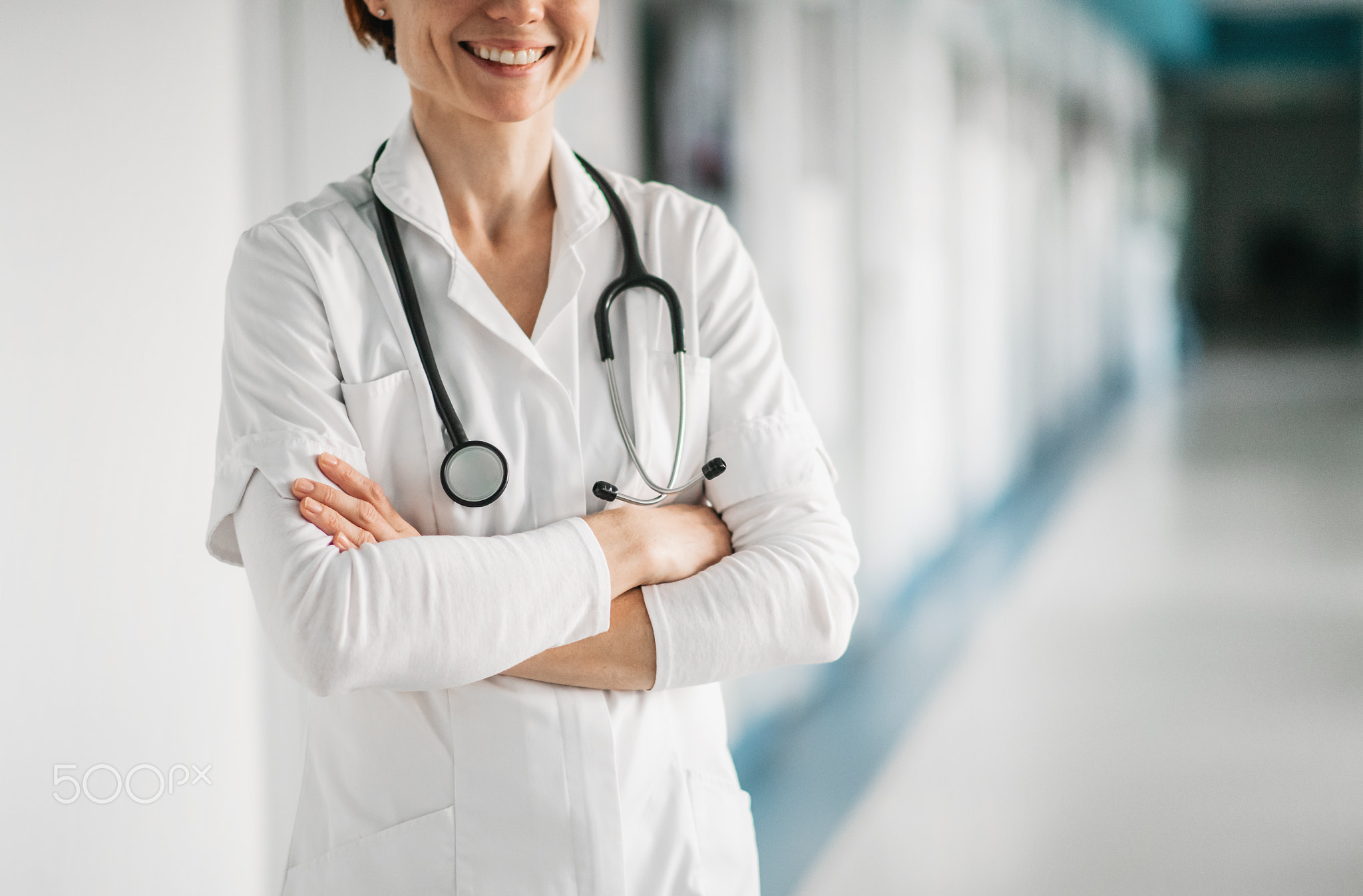 Unrecognizable woman doctor standing in hospital. Copy space.