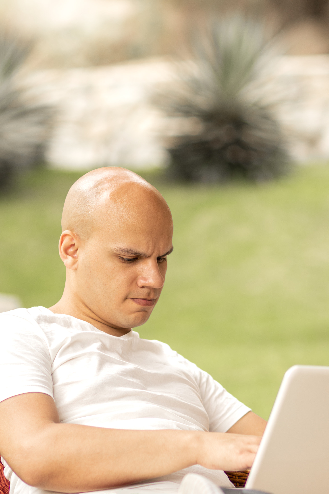 Young man with laptop outdoor