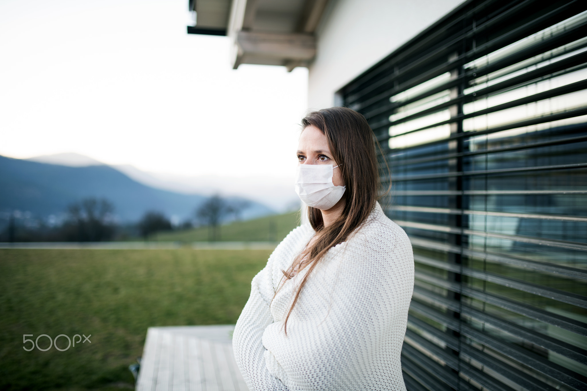 Woman with face masks outdoors at home, Corona virus and quarantine
