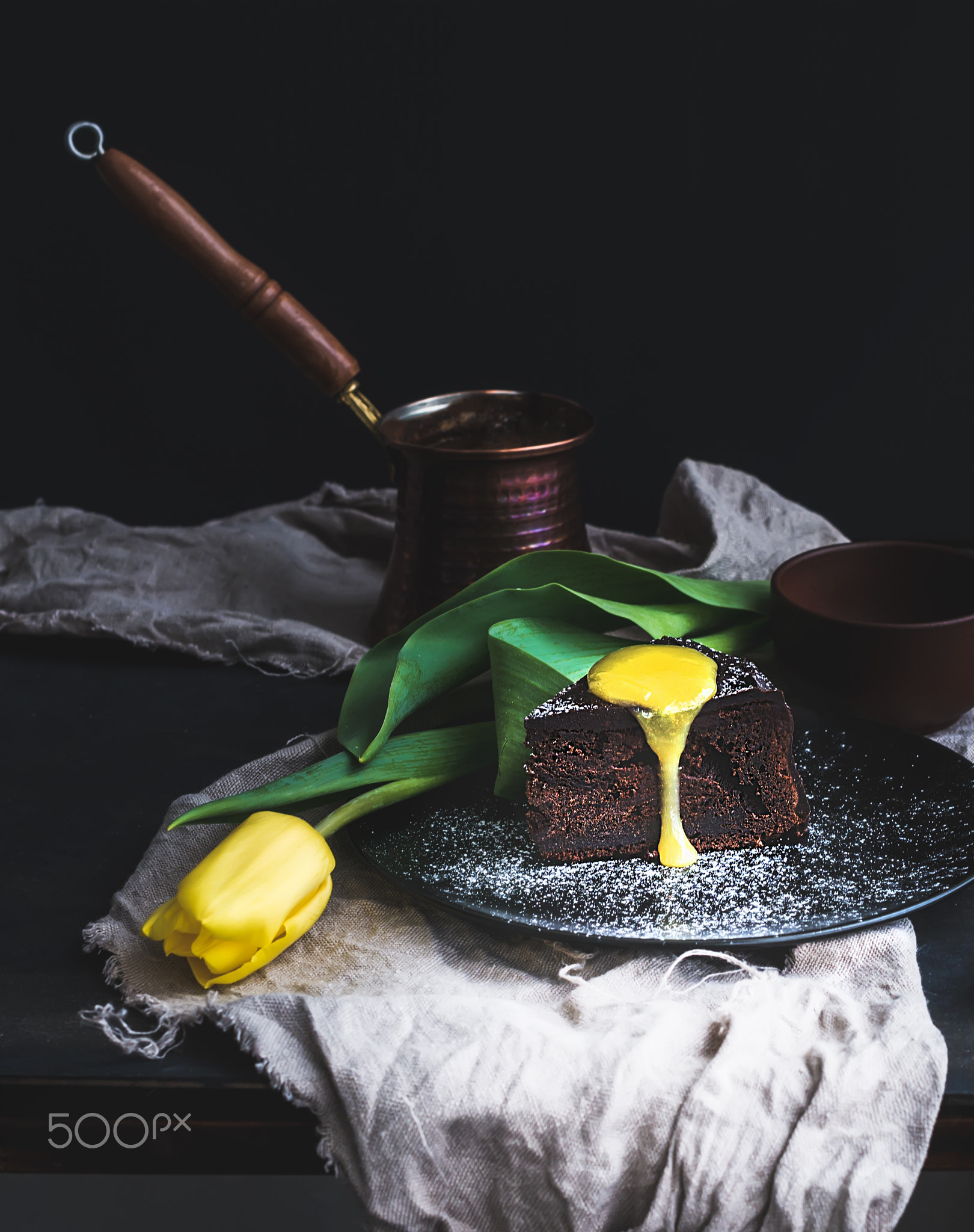 Perfect morning set for woman. Piece of truffle chocolate cake with lemon curd icing, hot coffee and