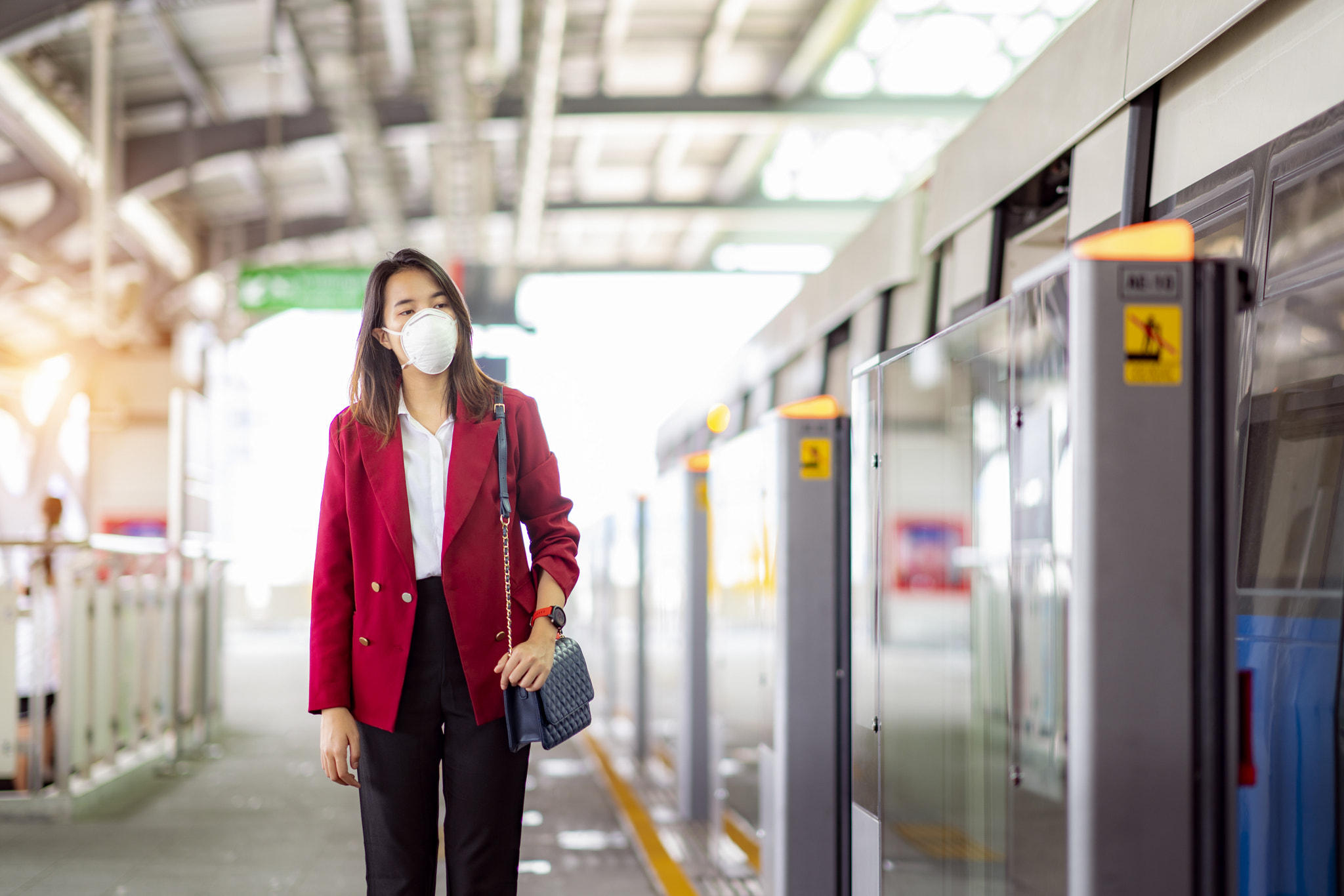 Asian girl use a protection mask for prevent PM 2.5 and covid 19