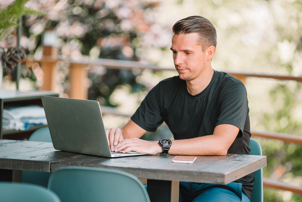 Young man with laptop works from home by Dmitry Travnikov on 500px.com