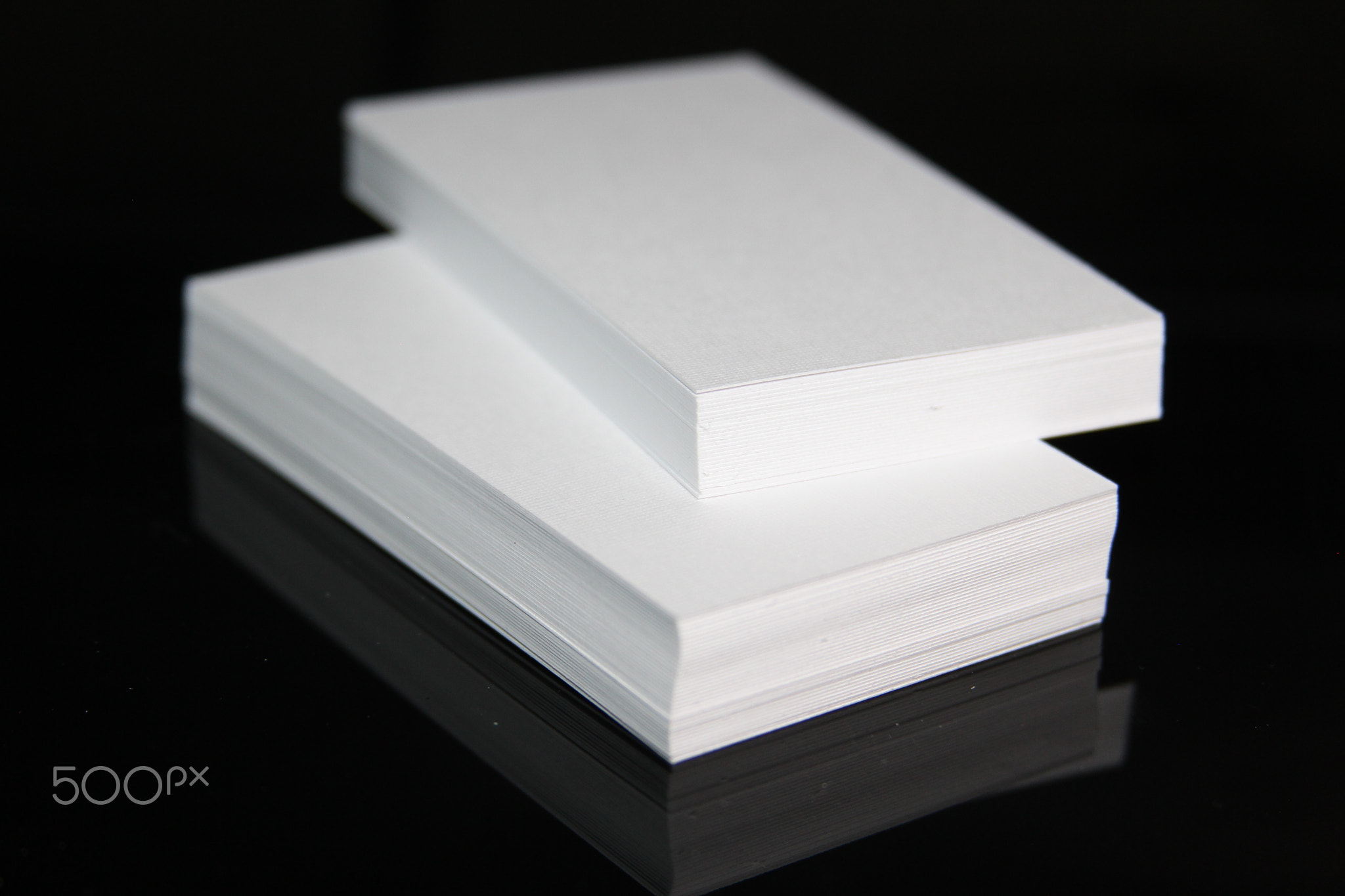 Business card on black background. Mockup business card