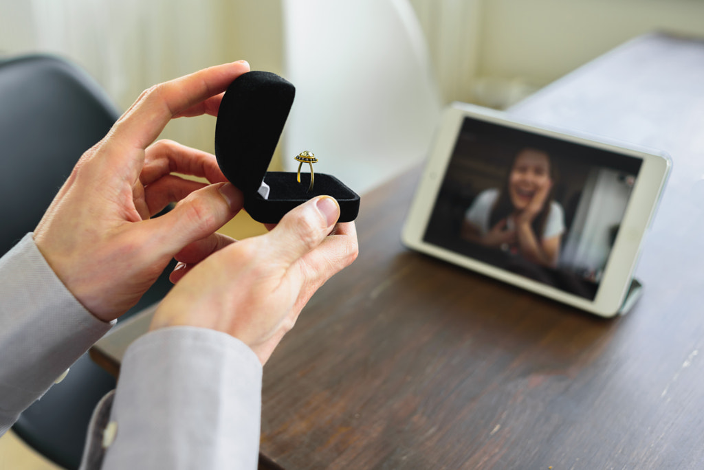 Man making marriage proposal to girlfriend online by Tatyana Aksenova on 500px.com