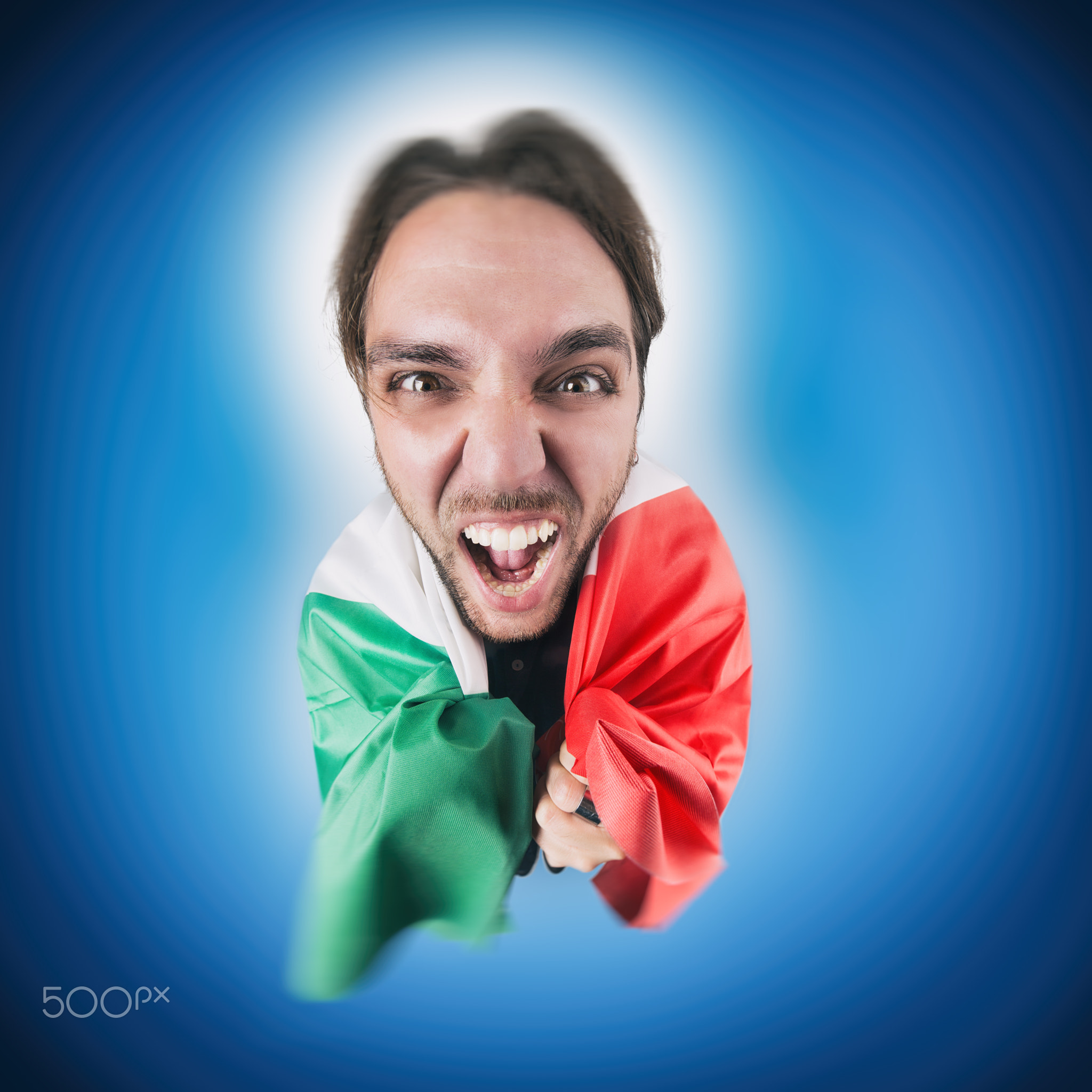 Italian soccer Fan holding the flag of Italy