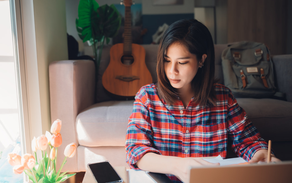 Beautiful asian young woman working from home by Platoo Fotography on 500px.com