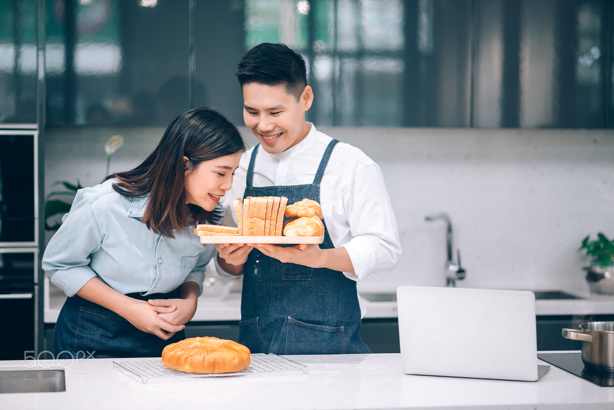 Asian Couple Preparing Homemade Bakery in the Kitchen