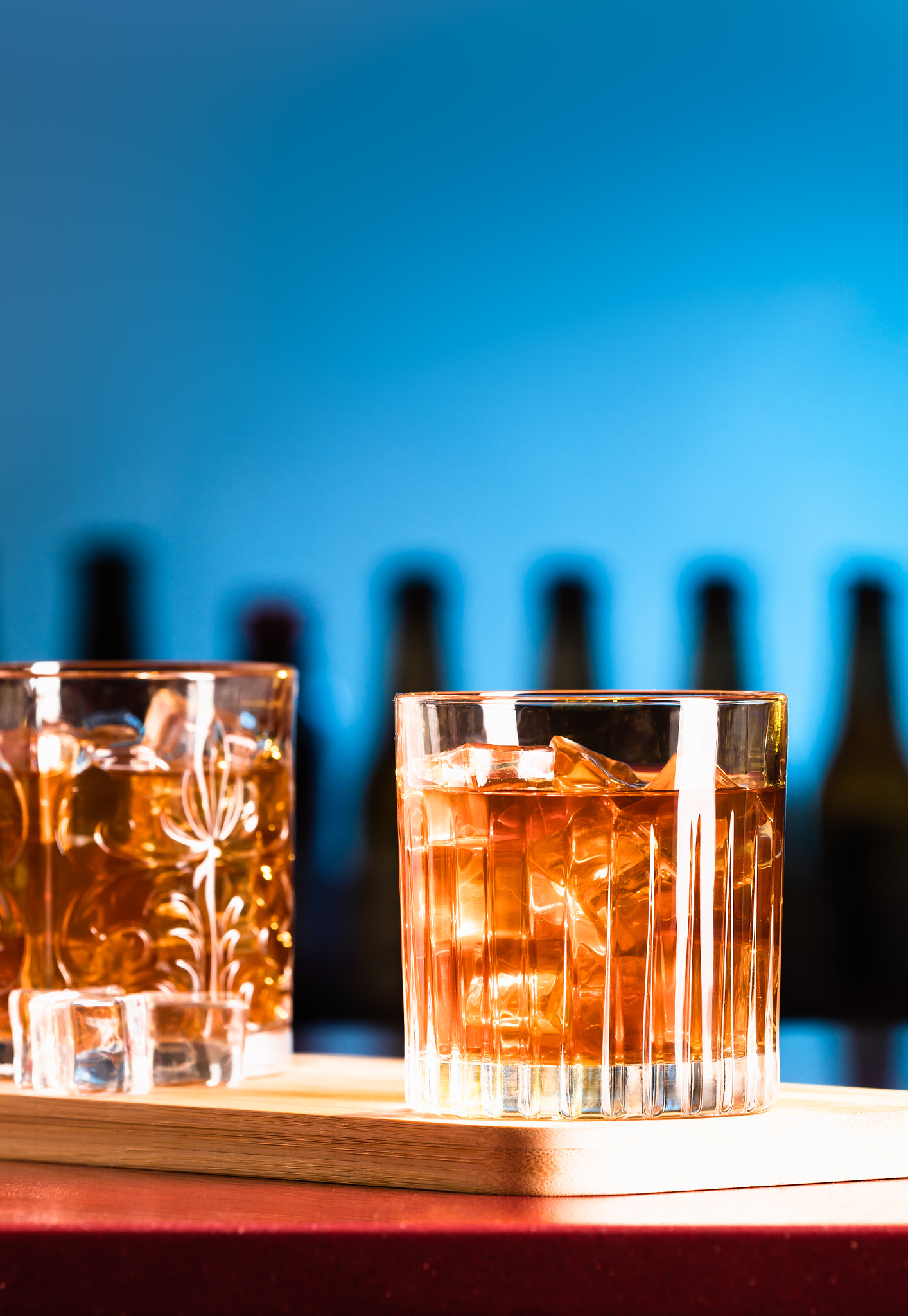 Whiskey glasses with ice in a lounge bar