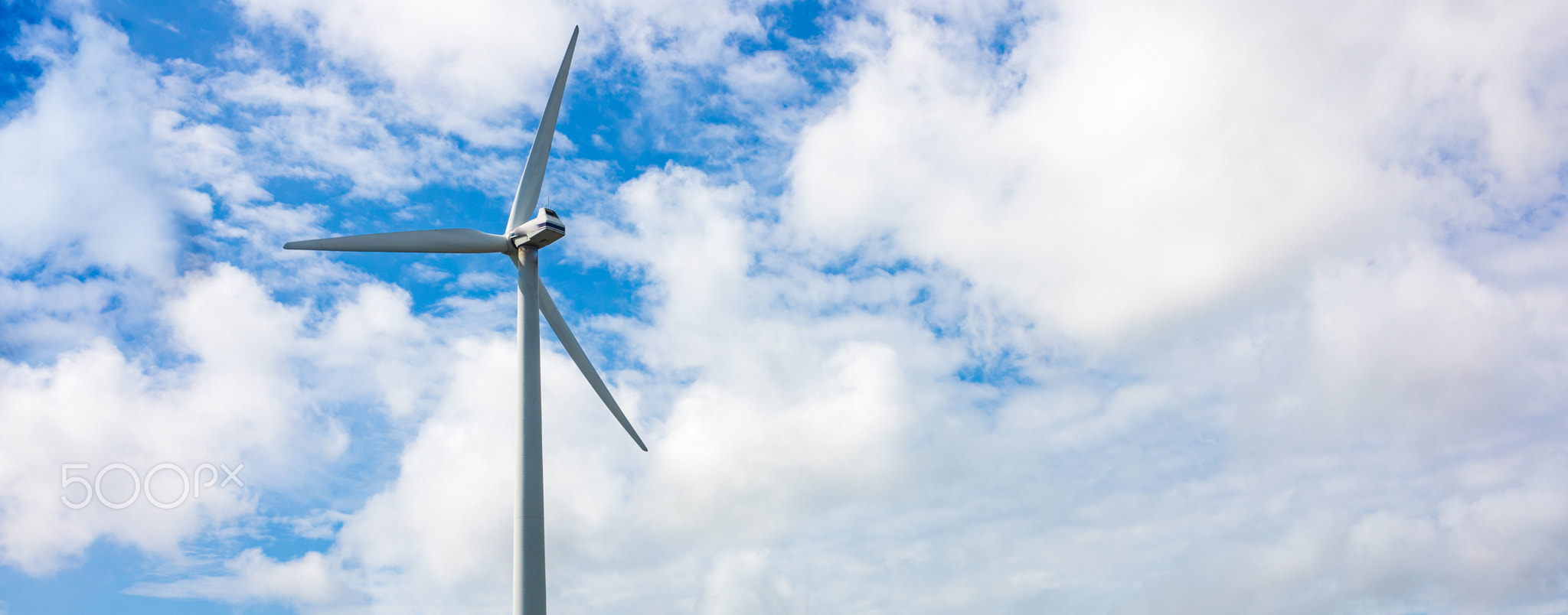 A windmill isolated on a cloudy day sky in Holland