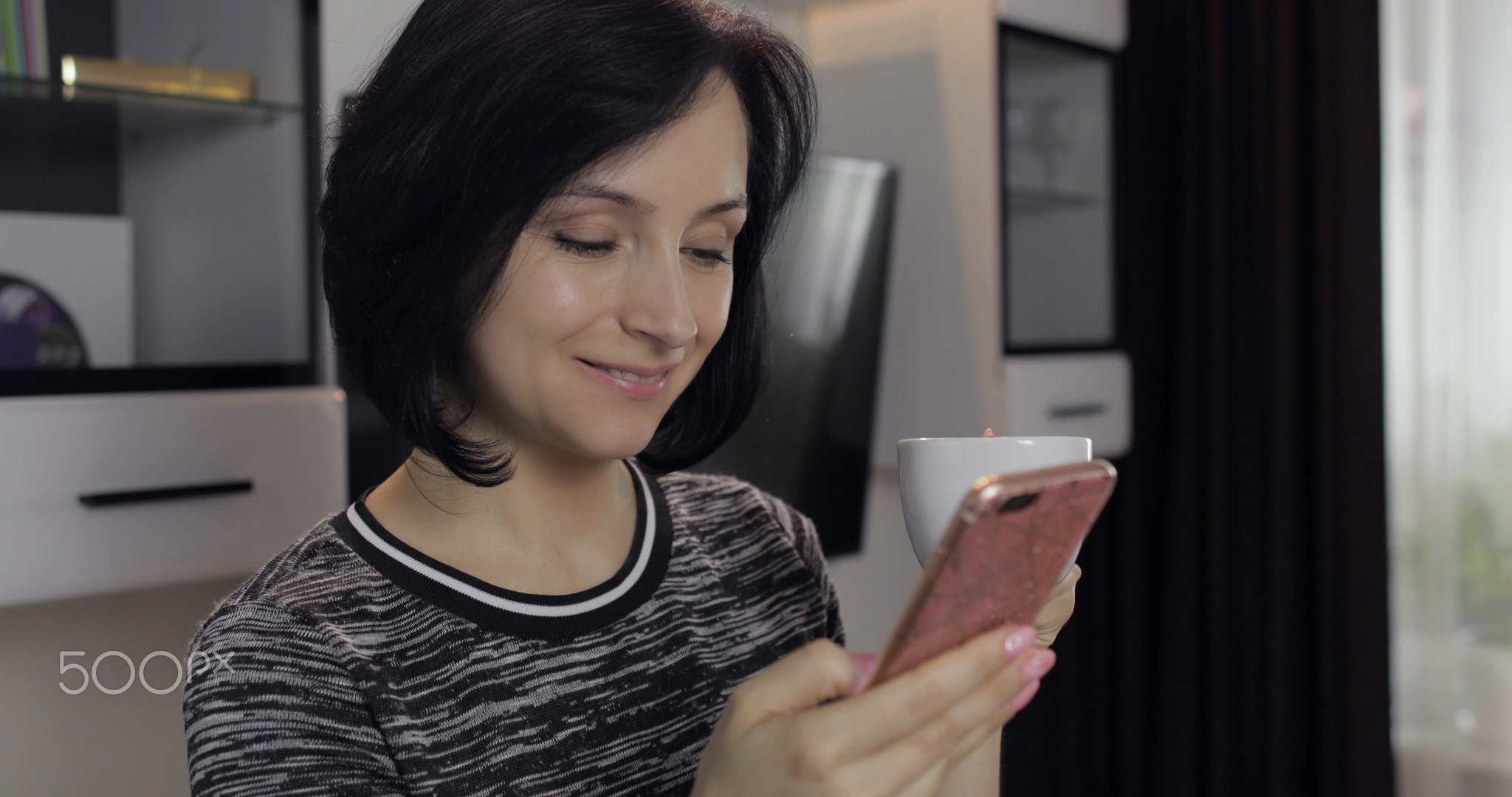 Woman having chat on social media using smartphone enjoying chatting