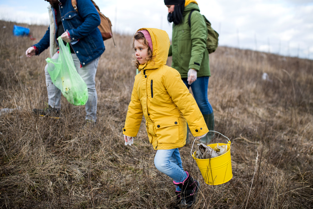 Group of activists picking up litter in nature, environmental by Jozef Polc on 500px.com