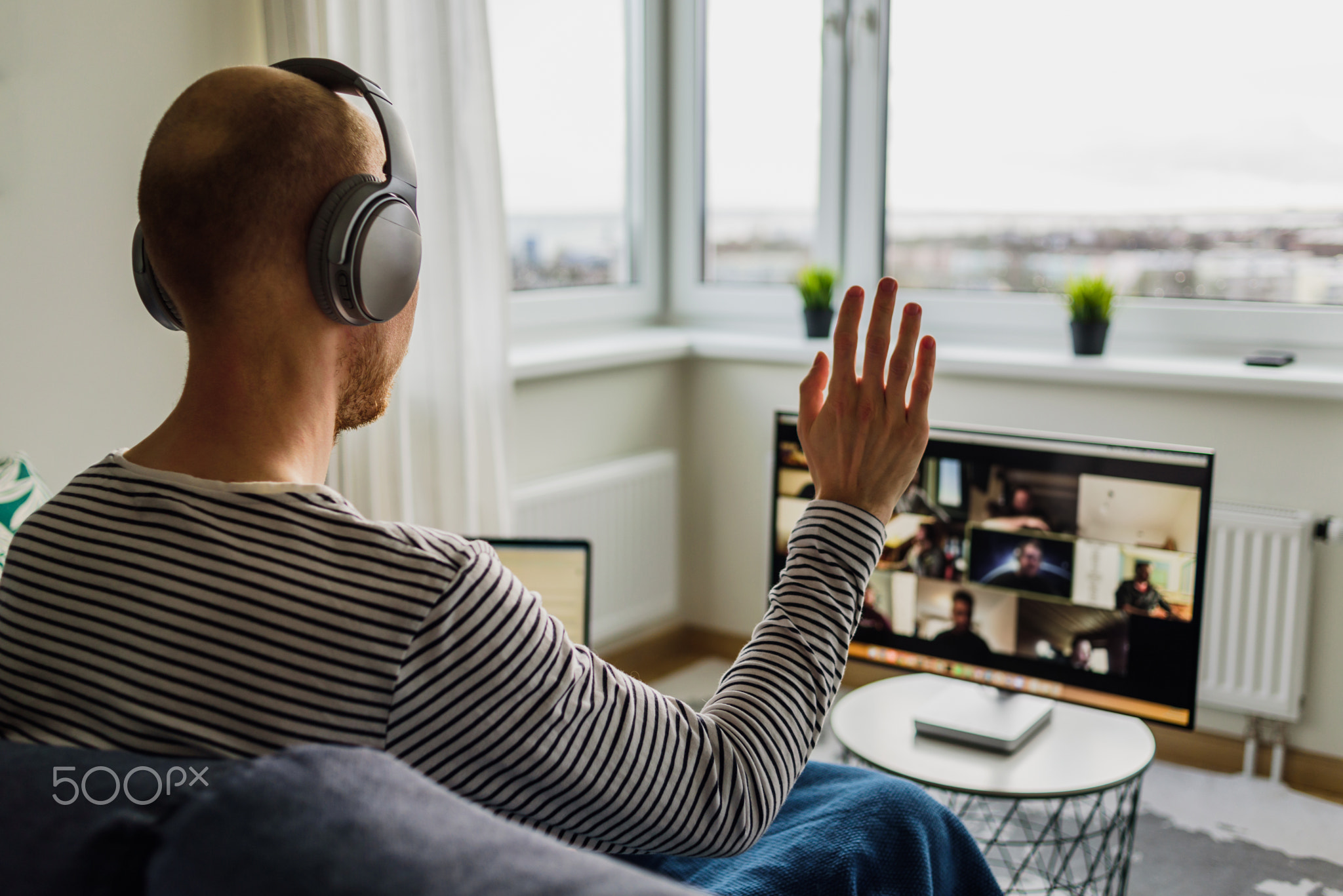 Man having video call with colleagues