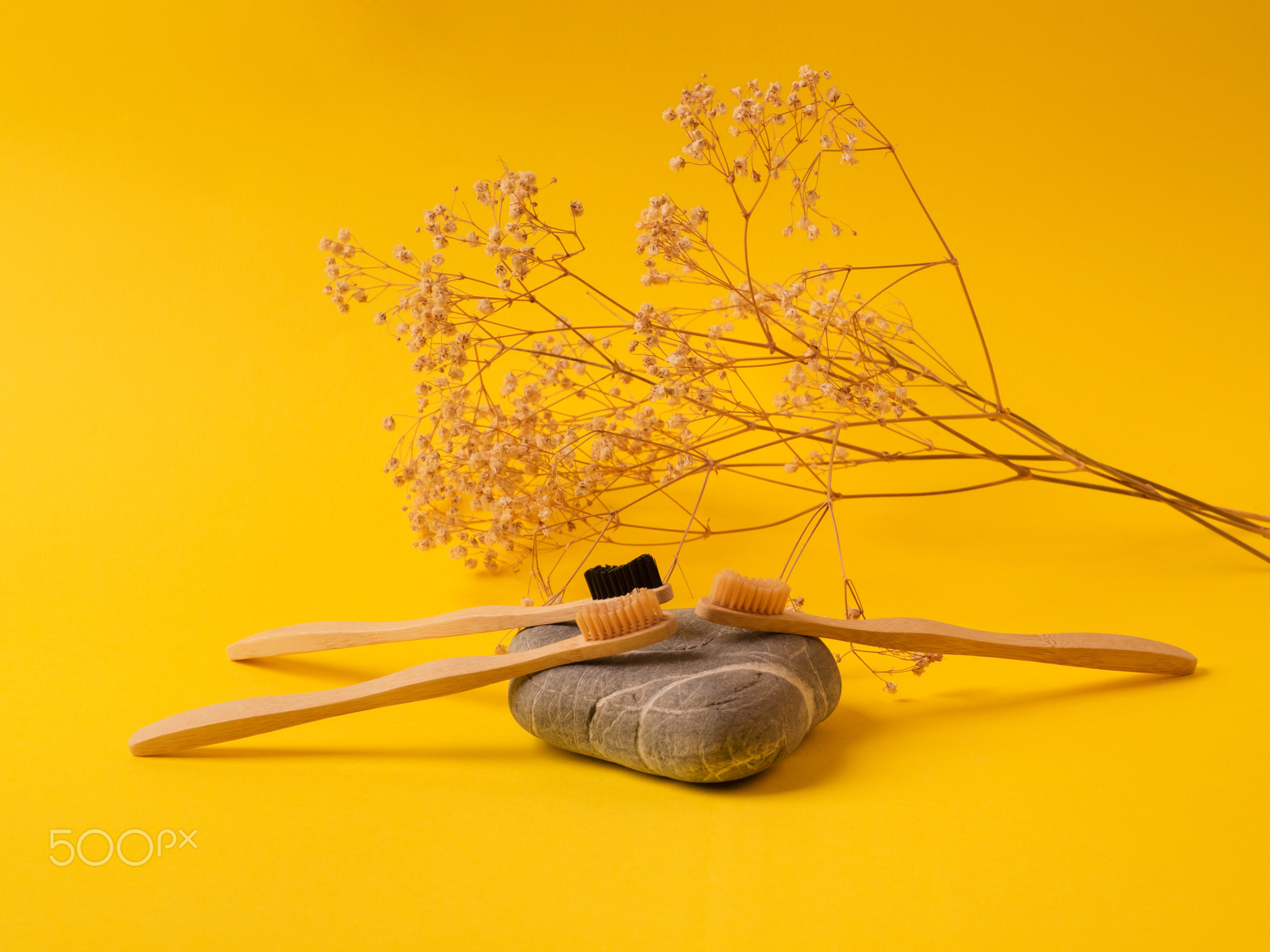 Zero waste bamboo toothbrushes on yellow