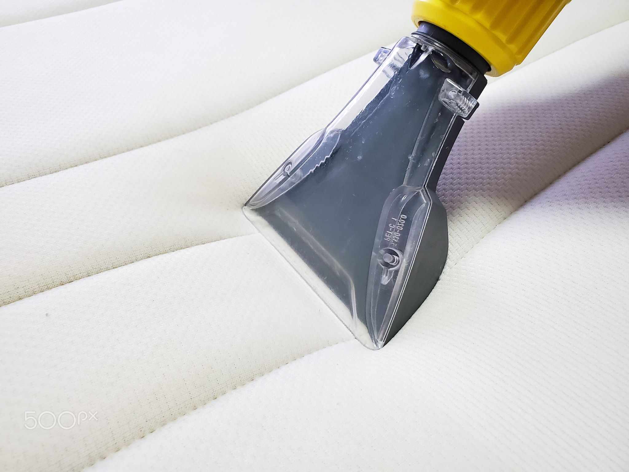 Mattress dry cleaning with professional extraction method. Close up