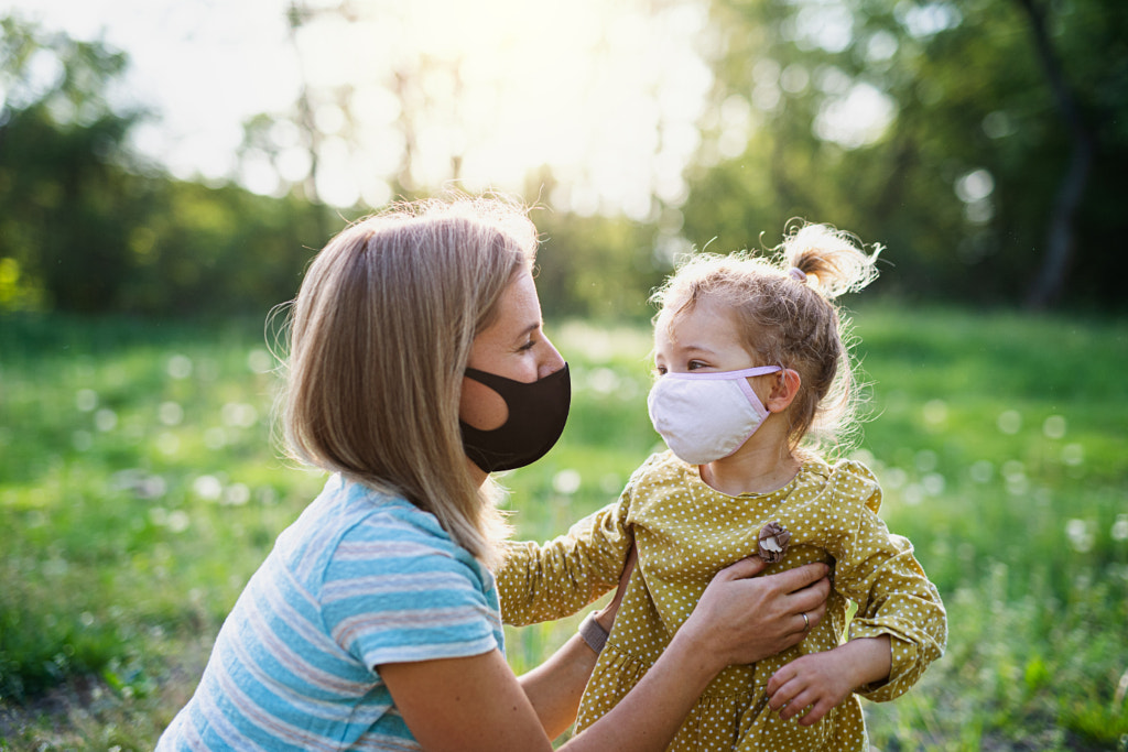 Side view of happy mother talking to small daughter in nature, wearing by Jozef Polc on 500px.com