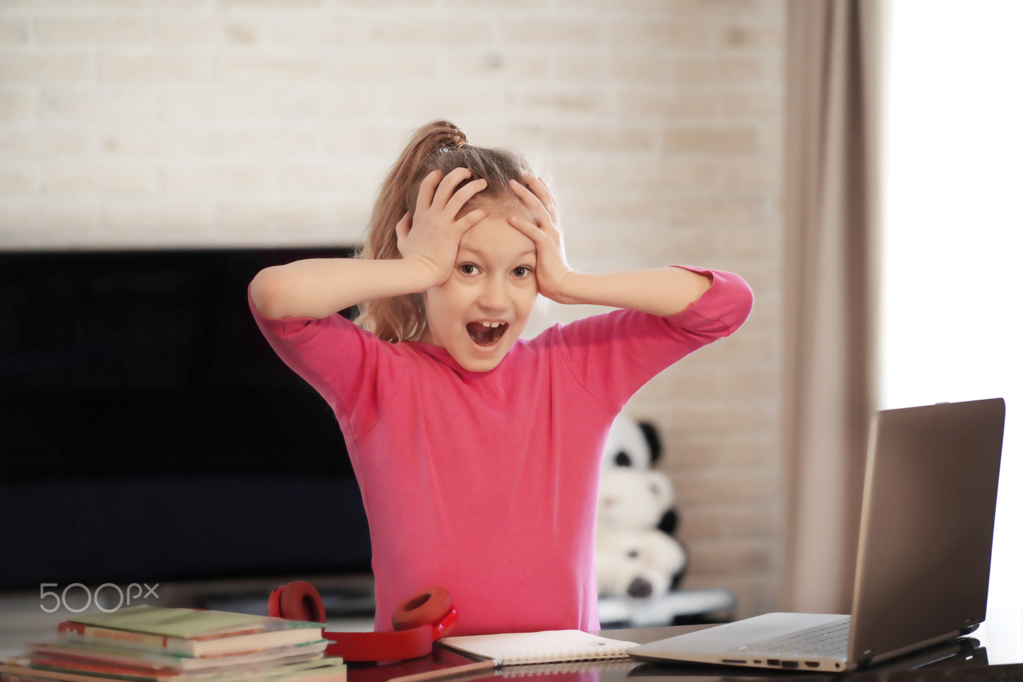 Emotional portrait of schoolgirl studying homework, home schooler