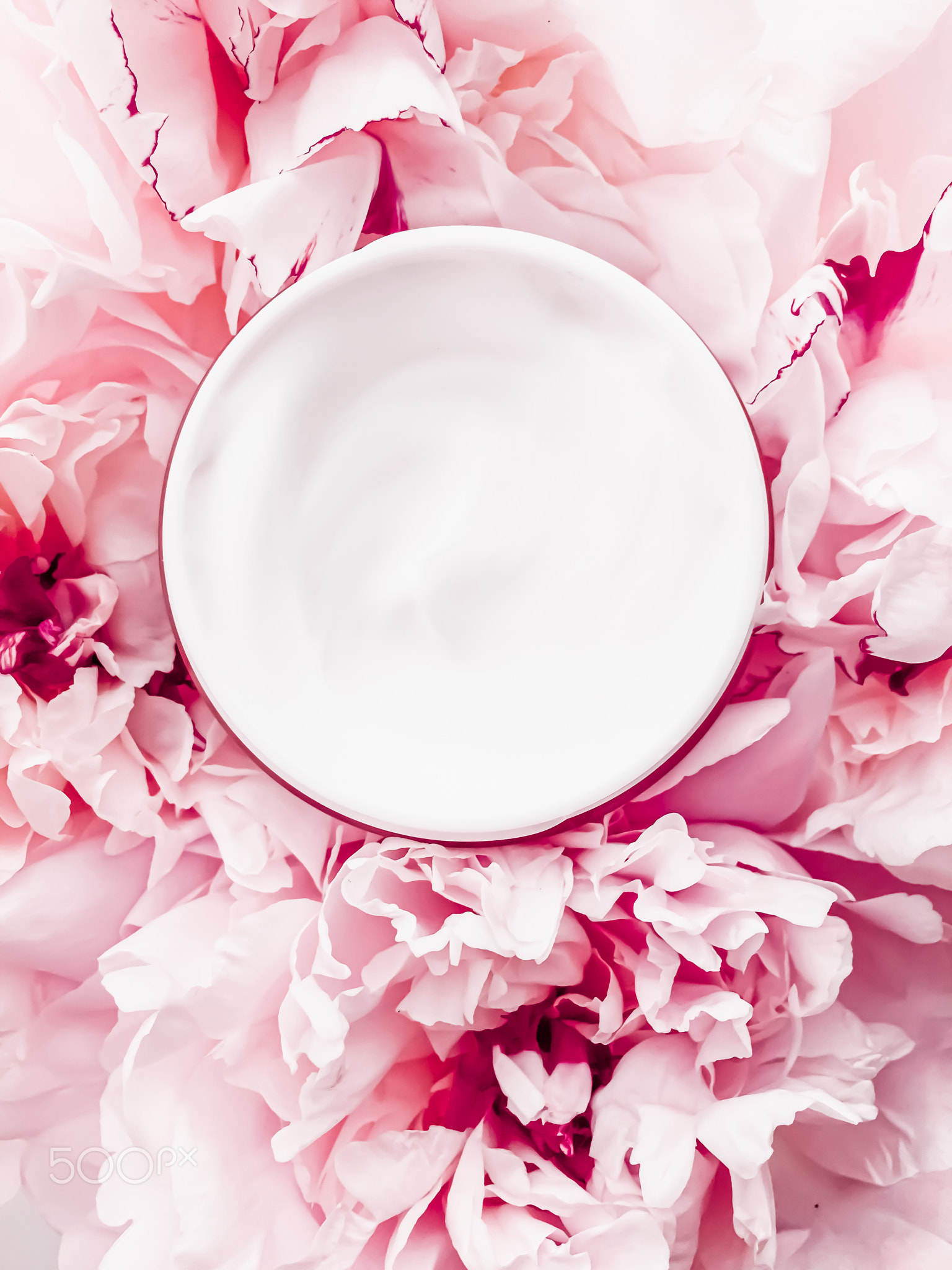 Face cream moisturizer on floral background as luxury skincare