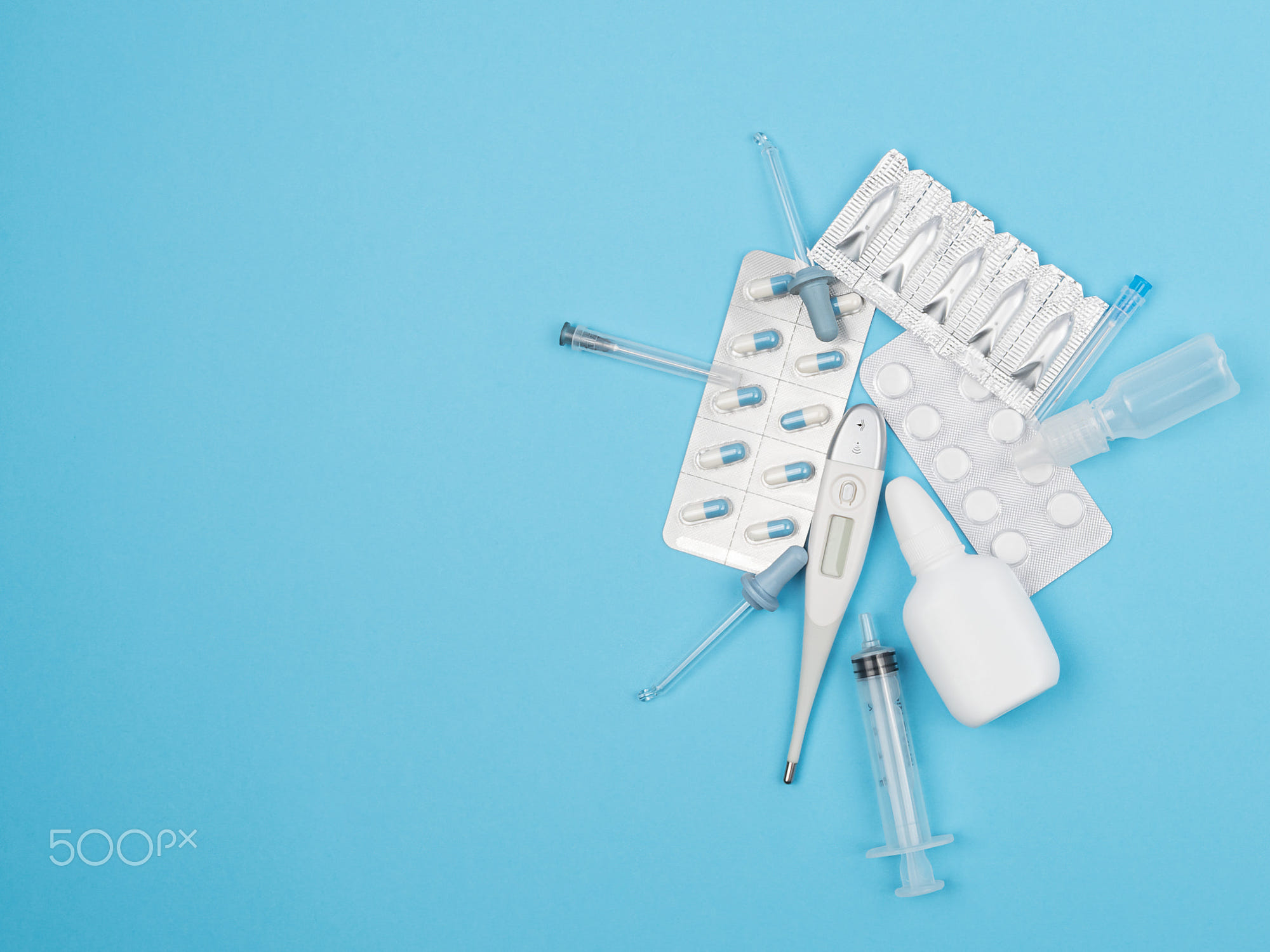 Medical objects on a blue background.: Medical objects on a blue background. Medicines and equipment.