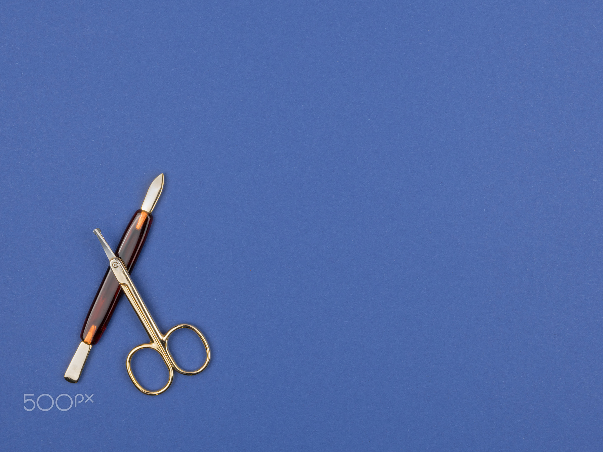 Instruments for manicure with a blue background.