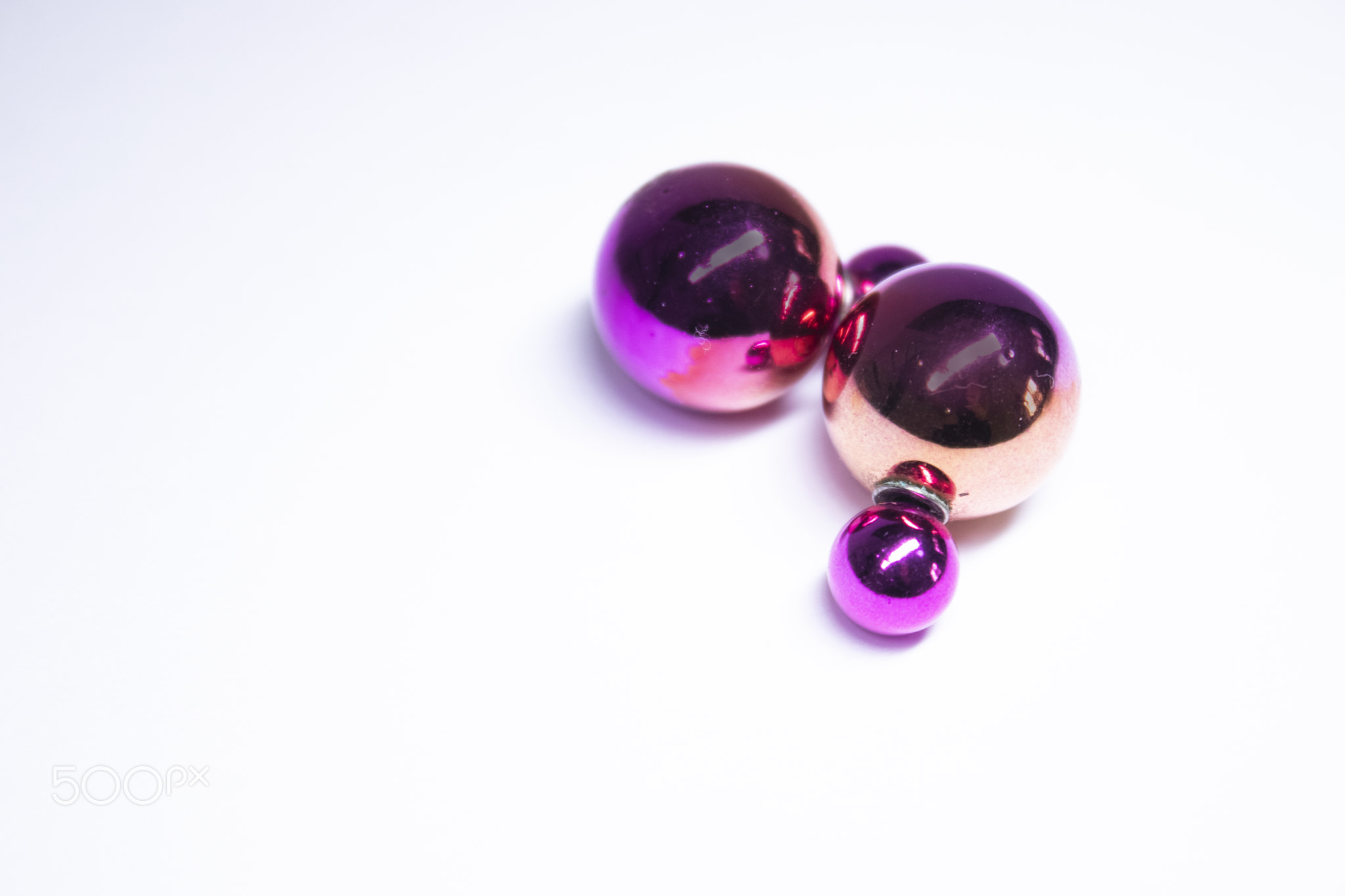 Pink round earrings. jewelry and accessories concept. Isolated, copy