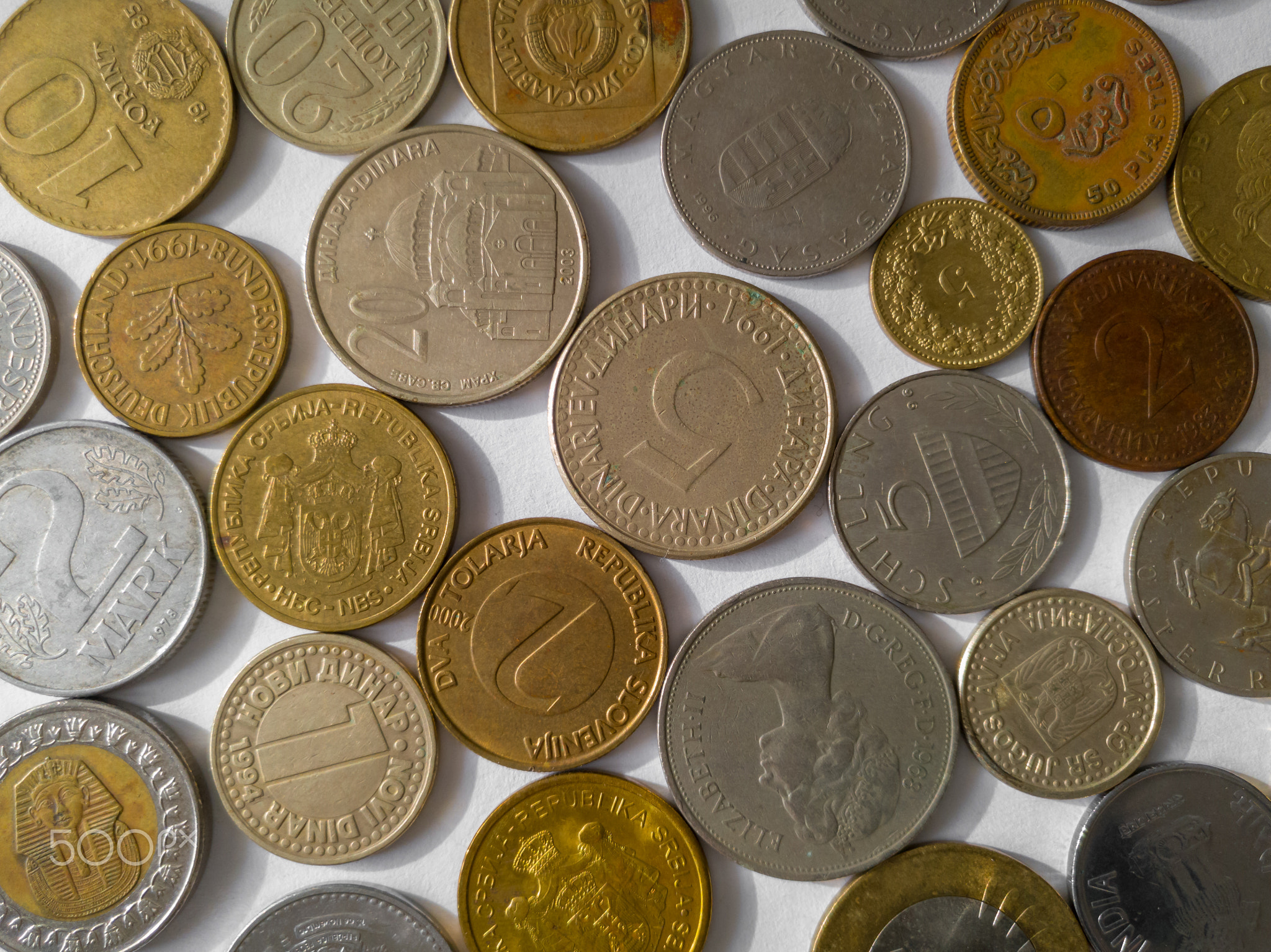 Various coins on white background