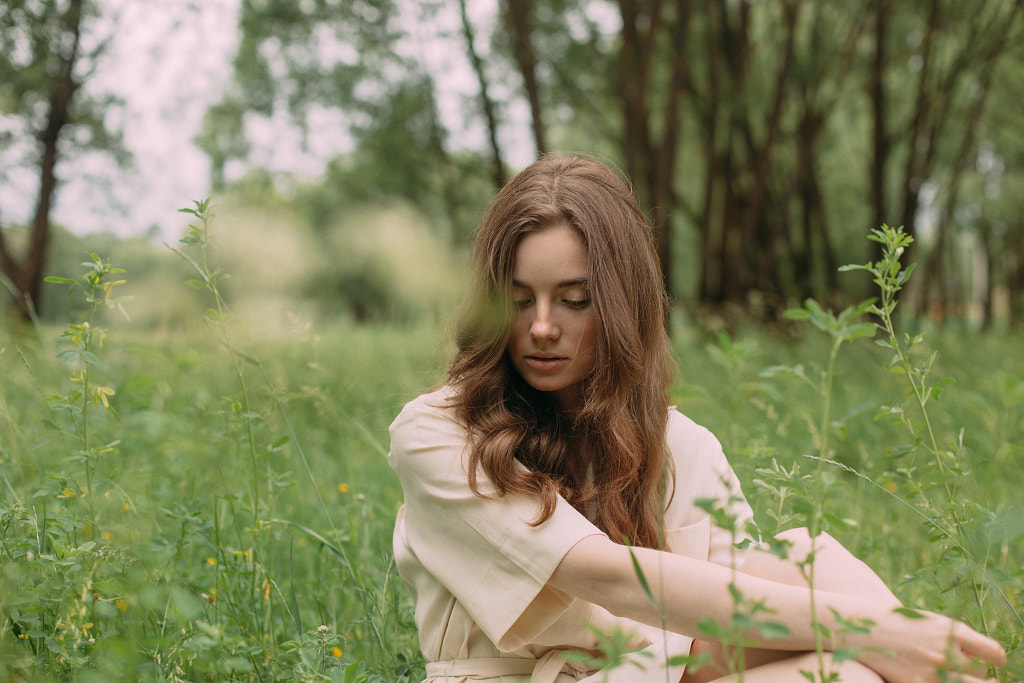 beautiful girl sitting in the grass outside by Alena Sadreeva on 500px.com