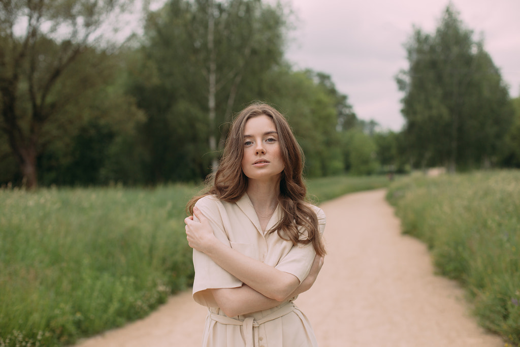  young woman stands on a sandy road by Alena Sadreeva on 500px.com