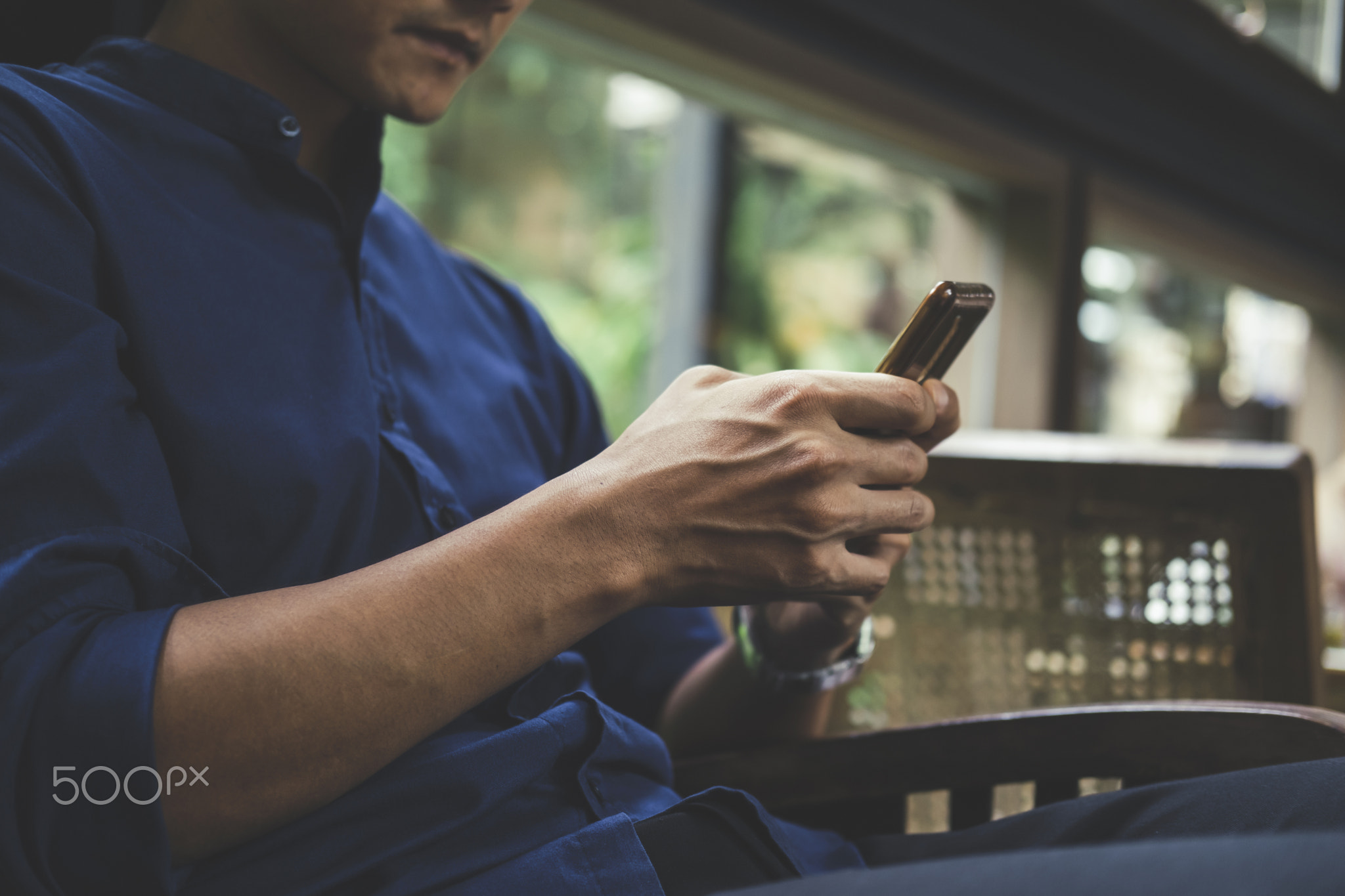 Close up of man using mobile phone.