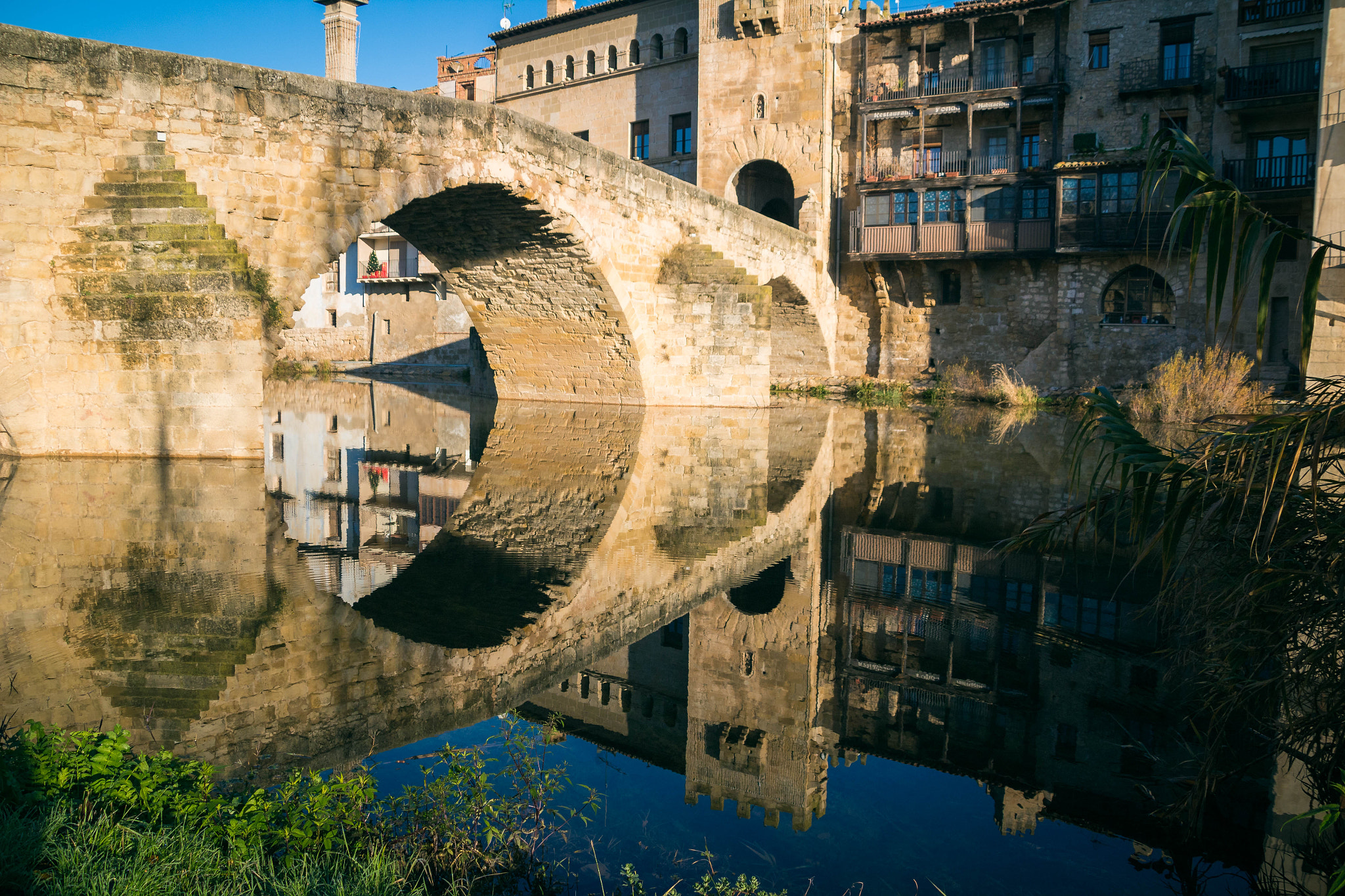 Old medieval stone bridge over the river