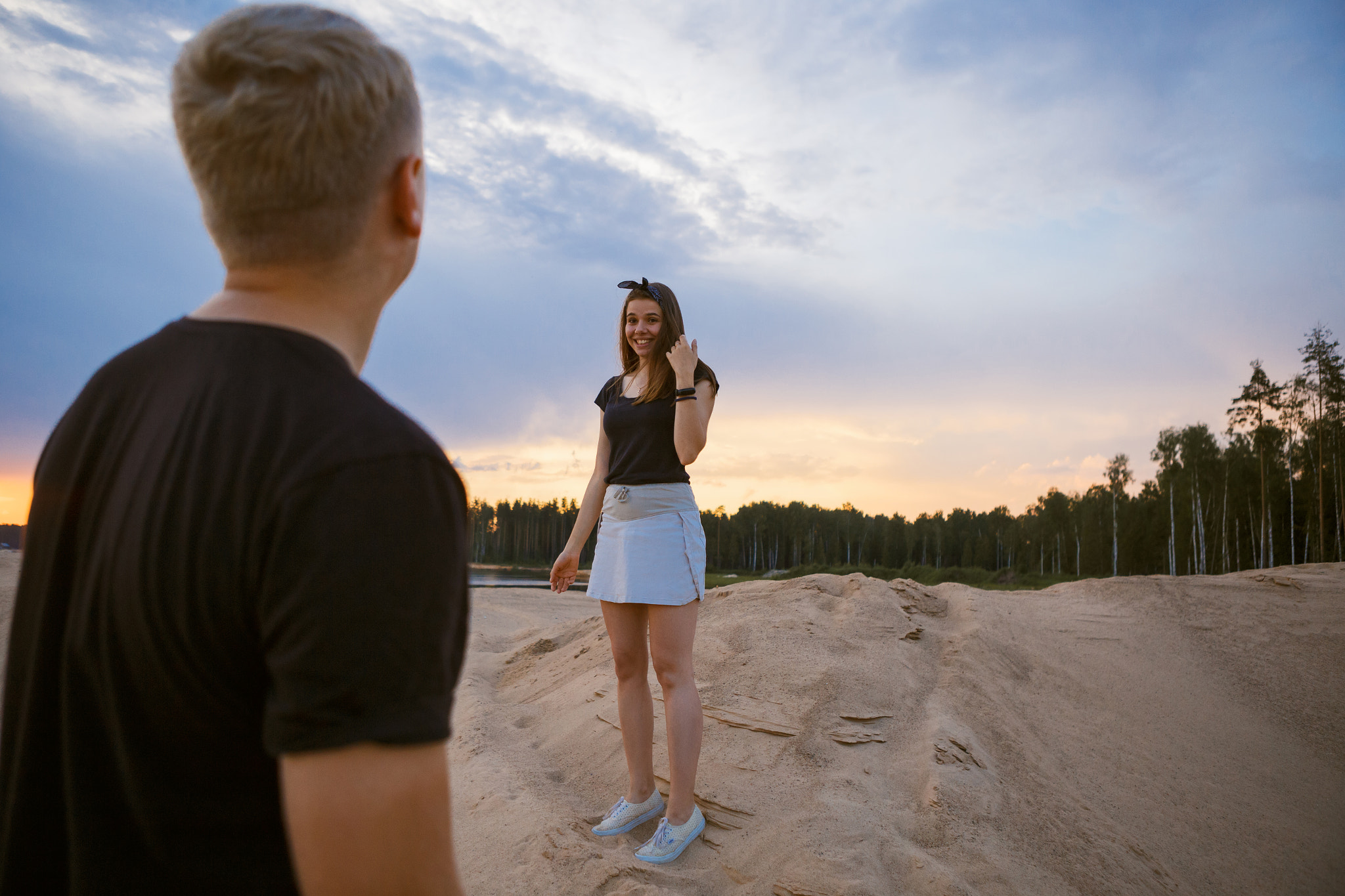 young couple in a sandpit