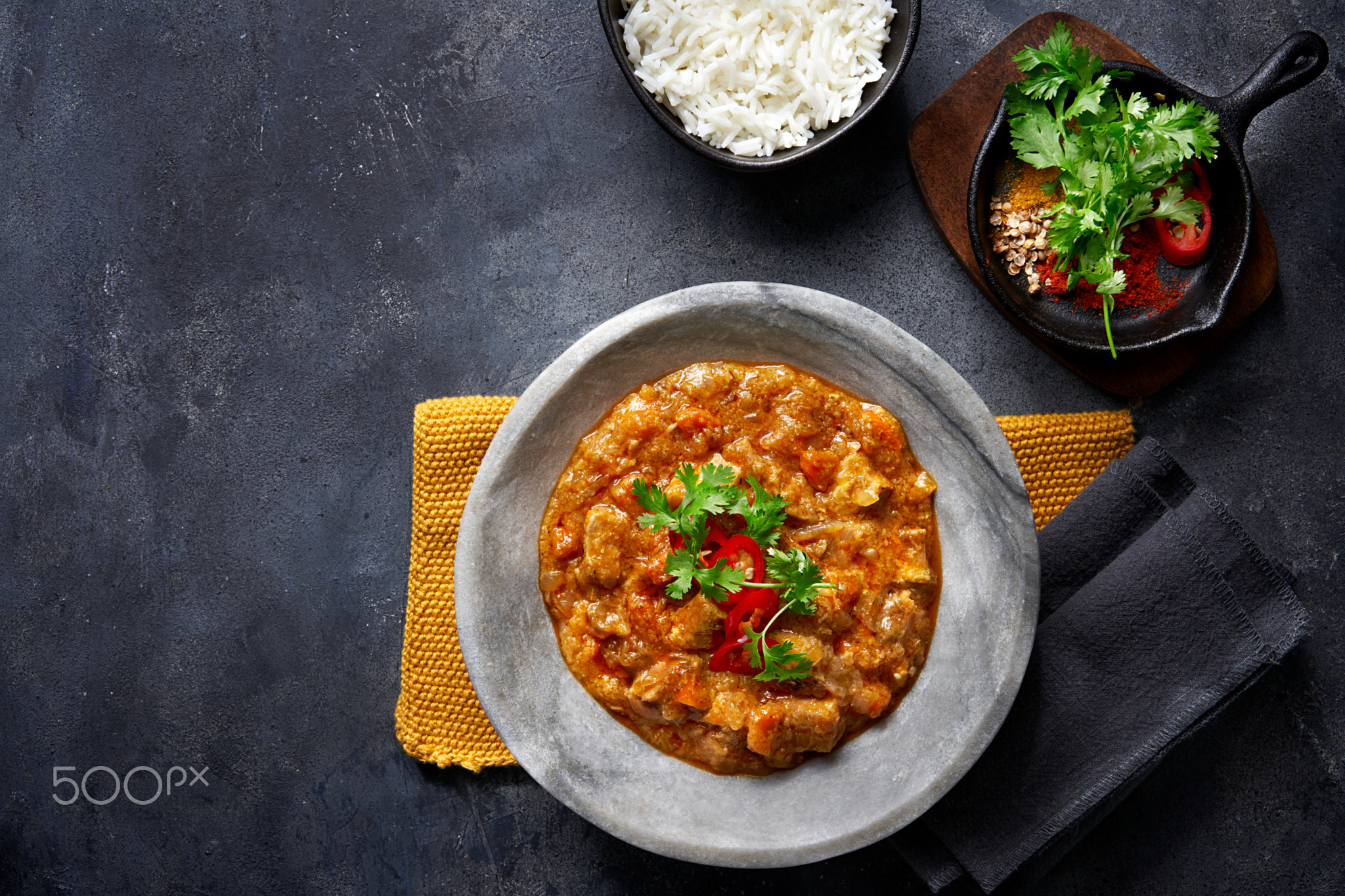 Chicken tikka masala spicy curry meat food in marbre plate.