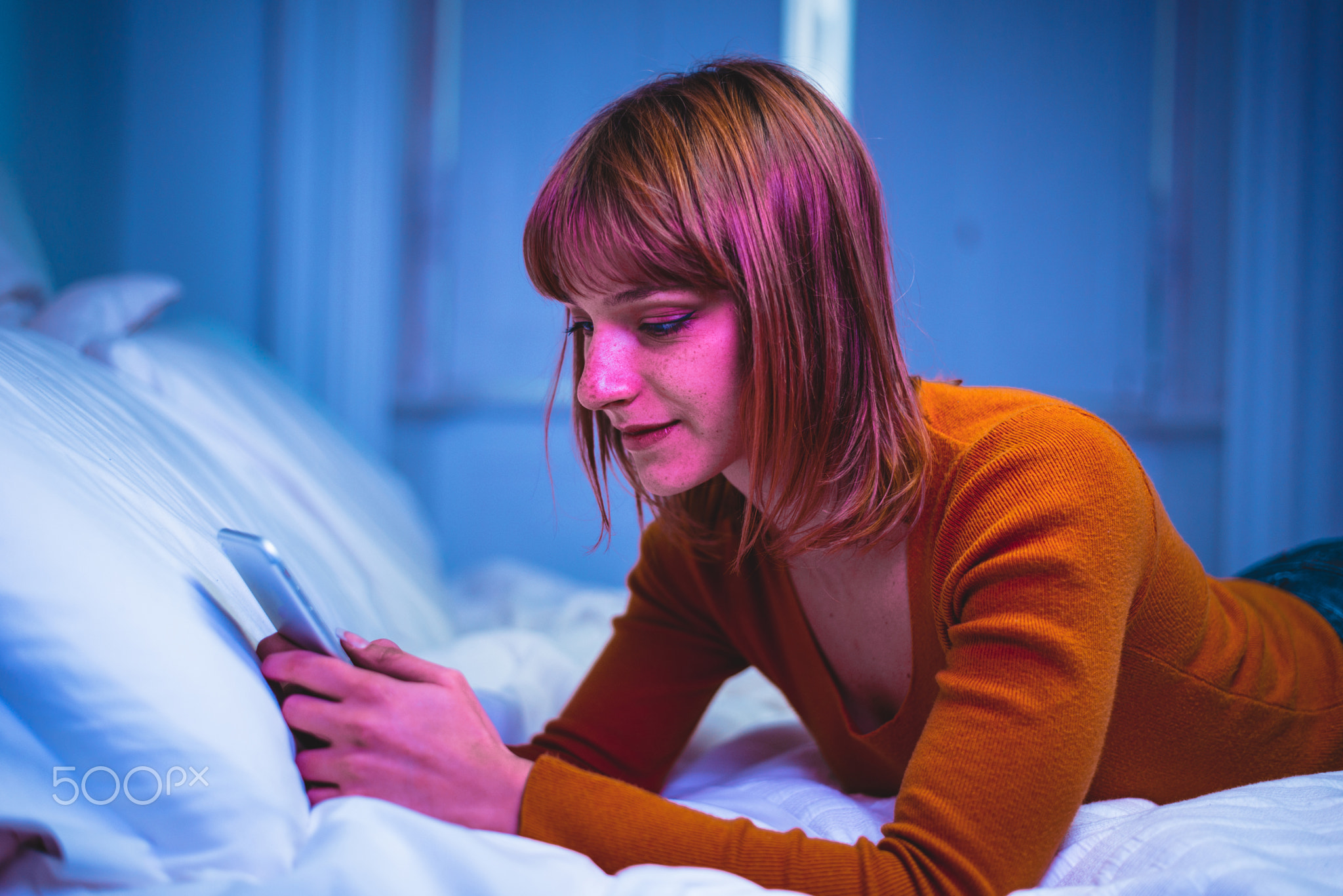 Young adult using smartphone at home