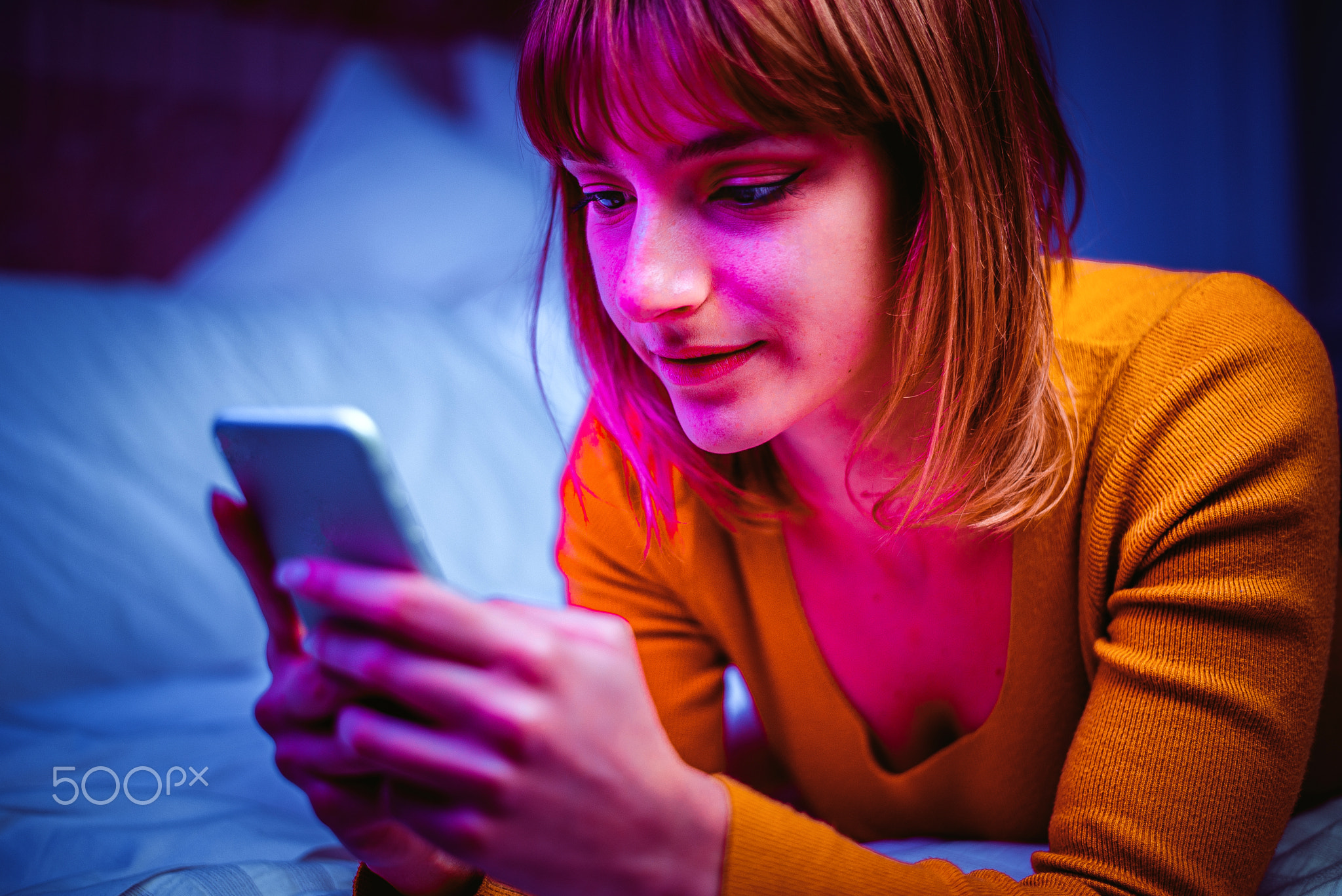 Young adult using smartphone at home