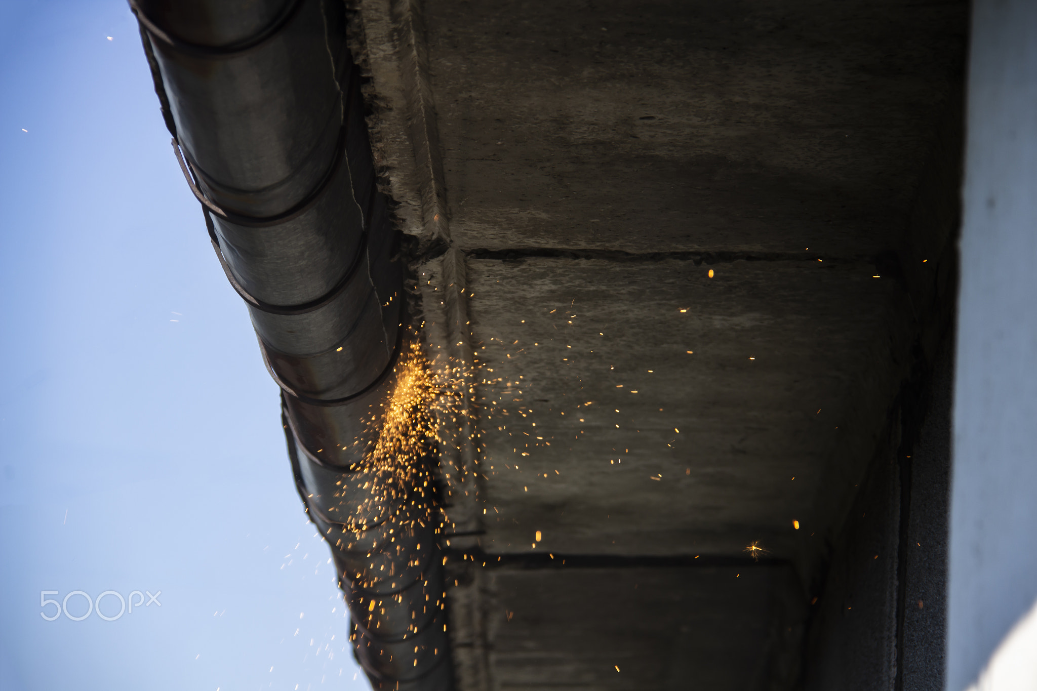 Replacement gutter system with Welding machine for a metal roof.