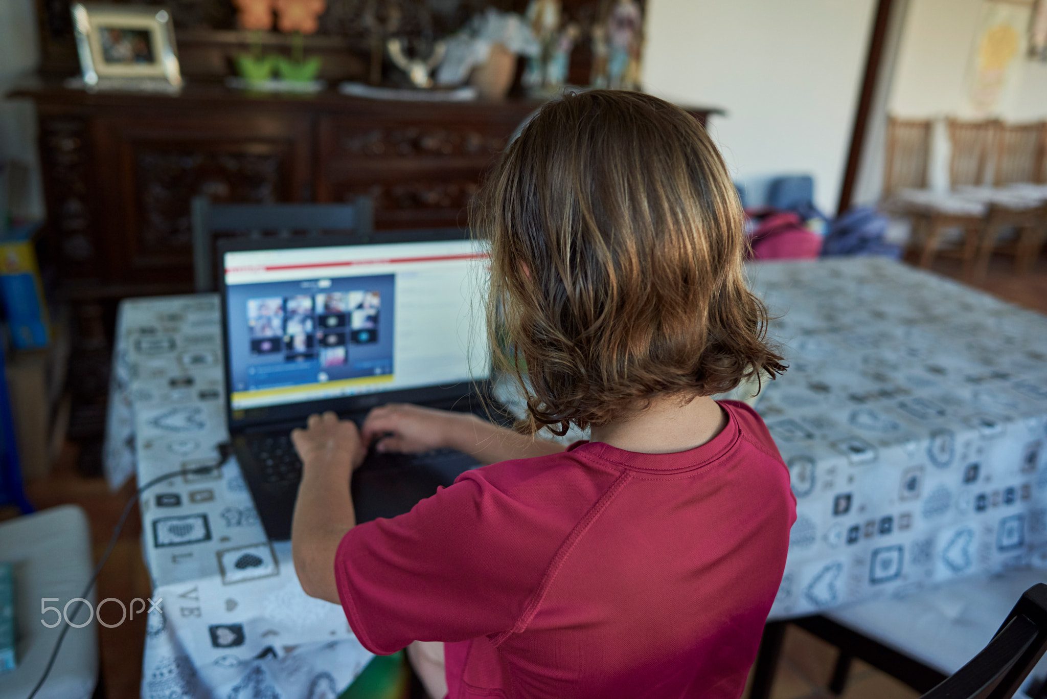 Girl typing on keyboard infront of the laptop, online meeting
