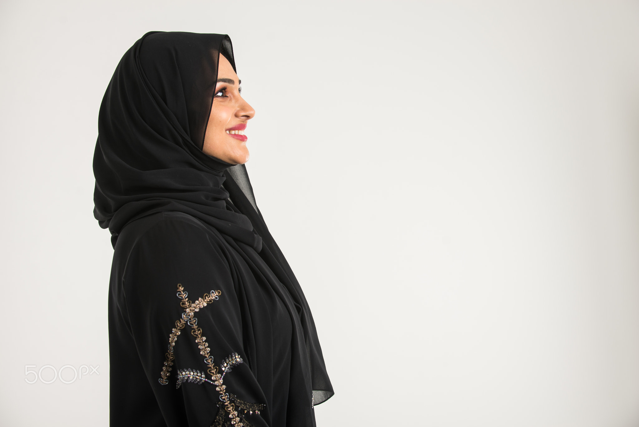 Arabic woman with abaya in studio