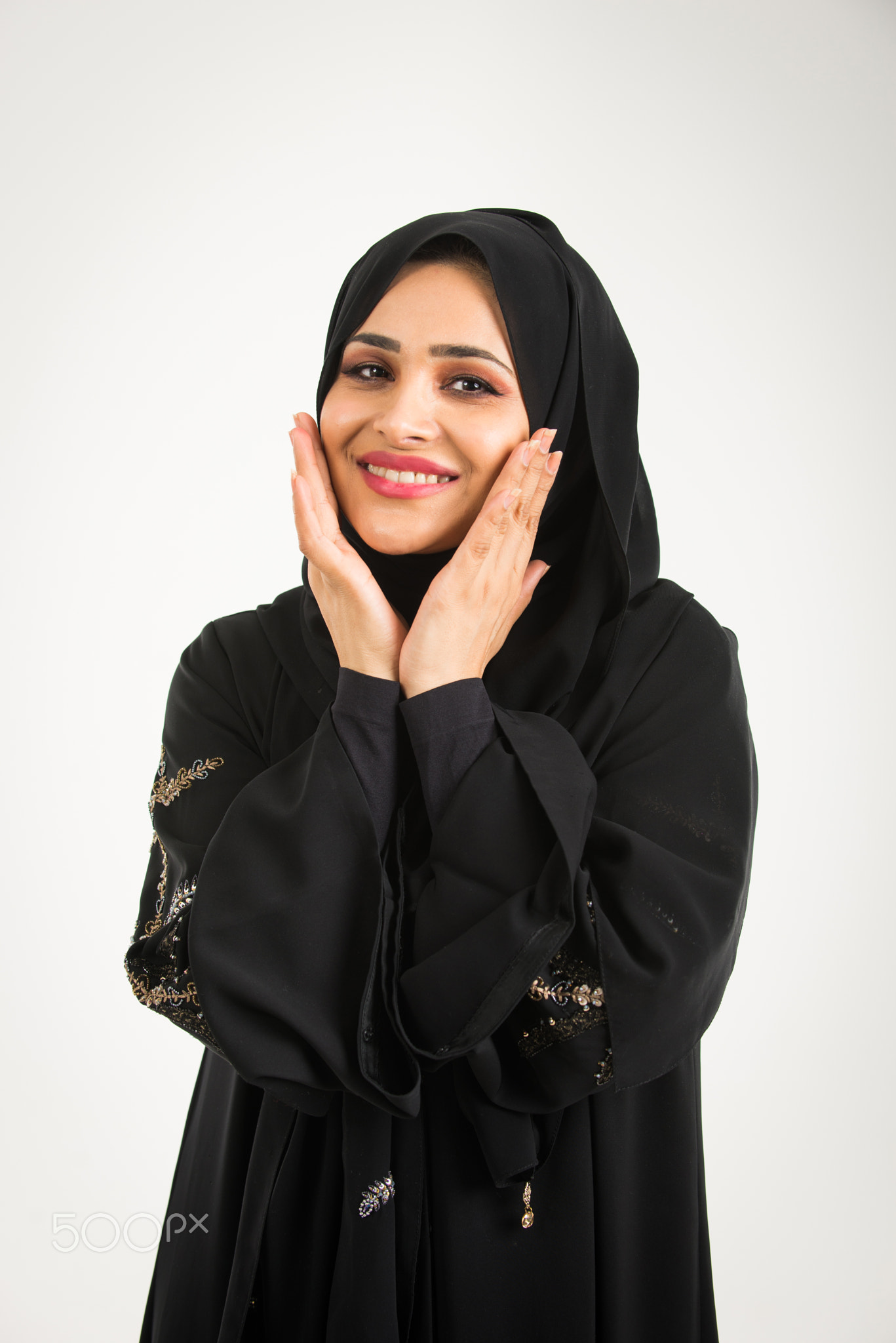 Arabic woman with abaya in studio