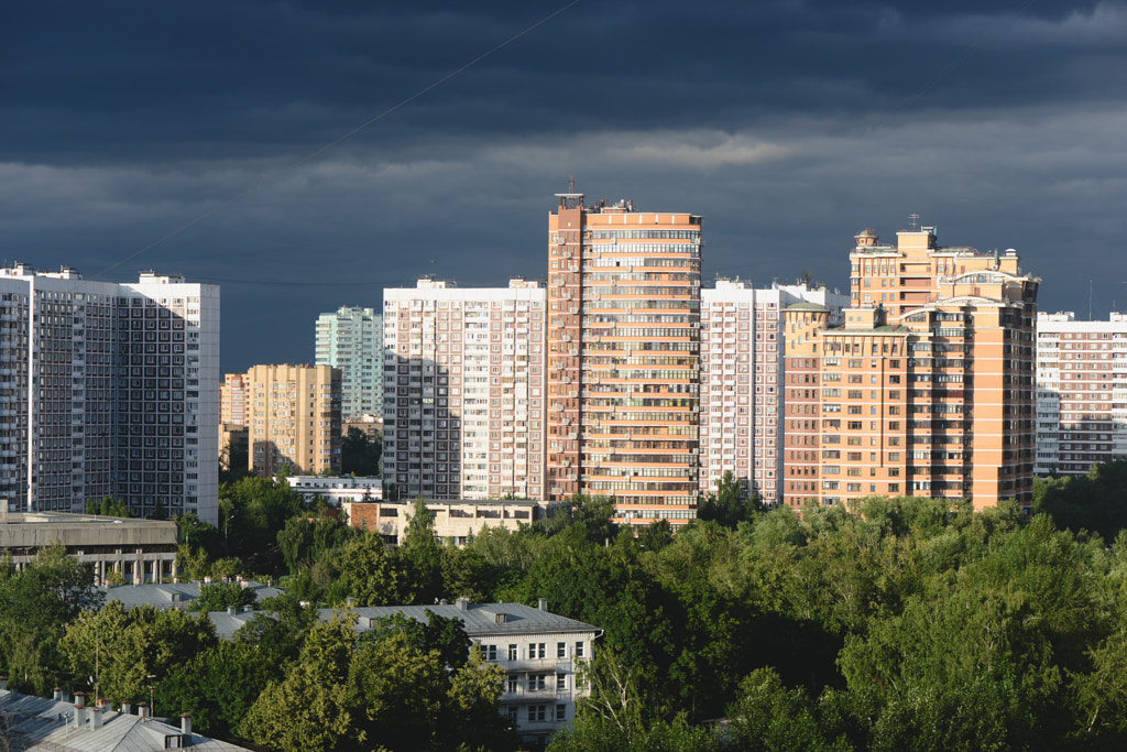 City buildings architecture, dark clouds sky, light and shadow by Anastasia A on 500px.com